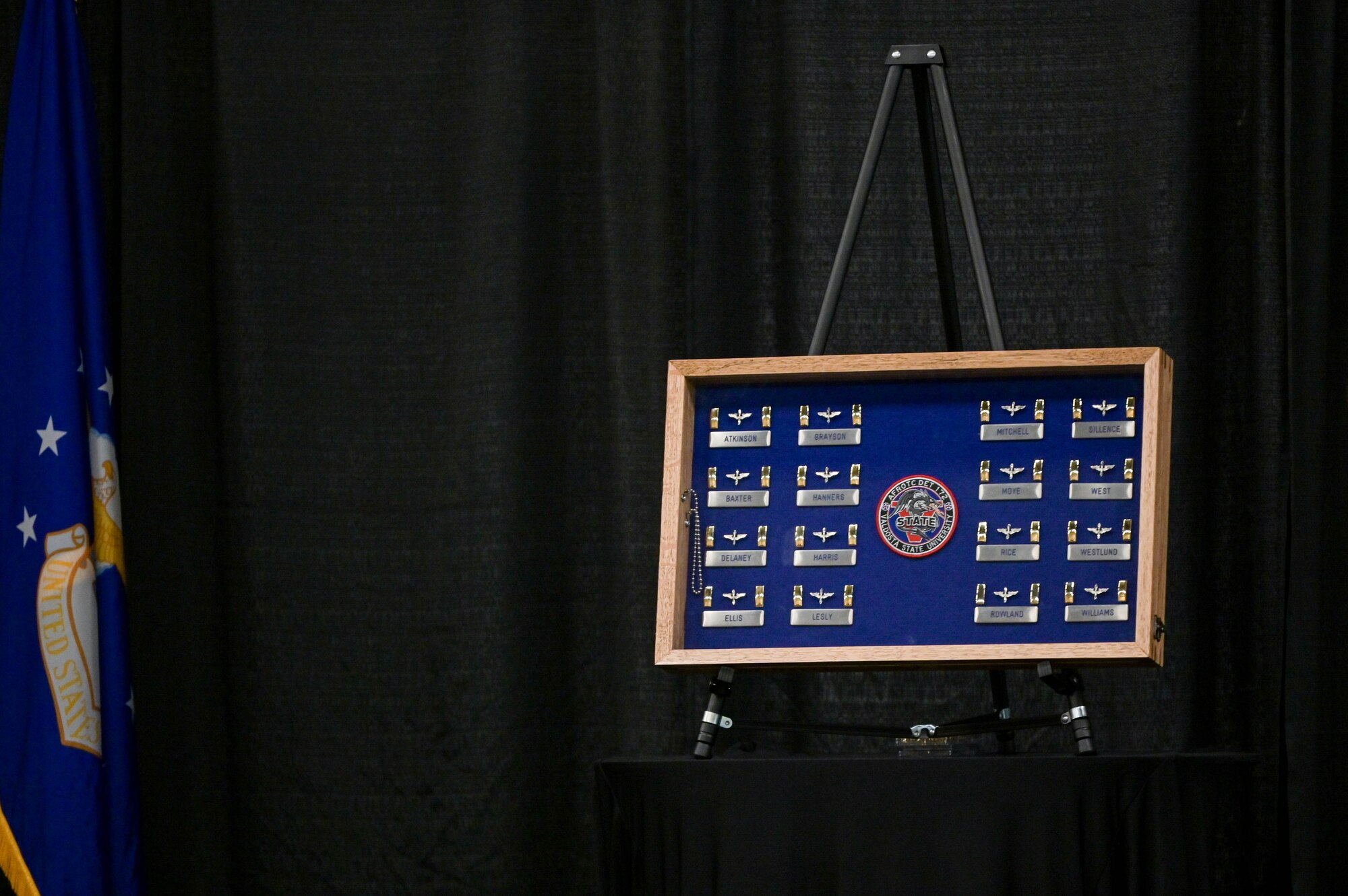 U.S. Air Force 2nd Lt. bars and cadets’ name tags are displayed on stage during the Valdosta State University Air Force ROTC Detachment 172 cadet awards ceremony at Valdosta, Georgia, April 27, 2022. Sixteen ROTC cadets completed their training and graduated into the operational Air Force. (U.S. Air Force photo by Senior Airman Rebeckah Medeiros)