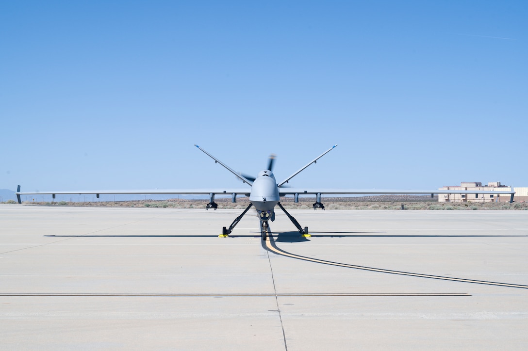 An MQ-9 Reaper from the 163rd Attack Wing, taxis on Edwards Air Force Base, California, May 4. The aircraft conducted an Agile Combat Employment (ACE) to a Forward Operating Site (FOS), flying from March Air Reserve Base to Edwards Air Force Base. (Air Force photo by Giancarlo Casem)