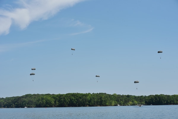 Soldiers from the 5th Ranger Training Battalion parachute into Lake Lanier, Georgia, May 5, 2022. This training involves jumpers practicing with a parachute coming down over their head in the water, surfacing and swimming out. (U.S. Army photo by Christopher Carranza)