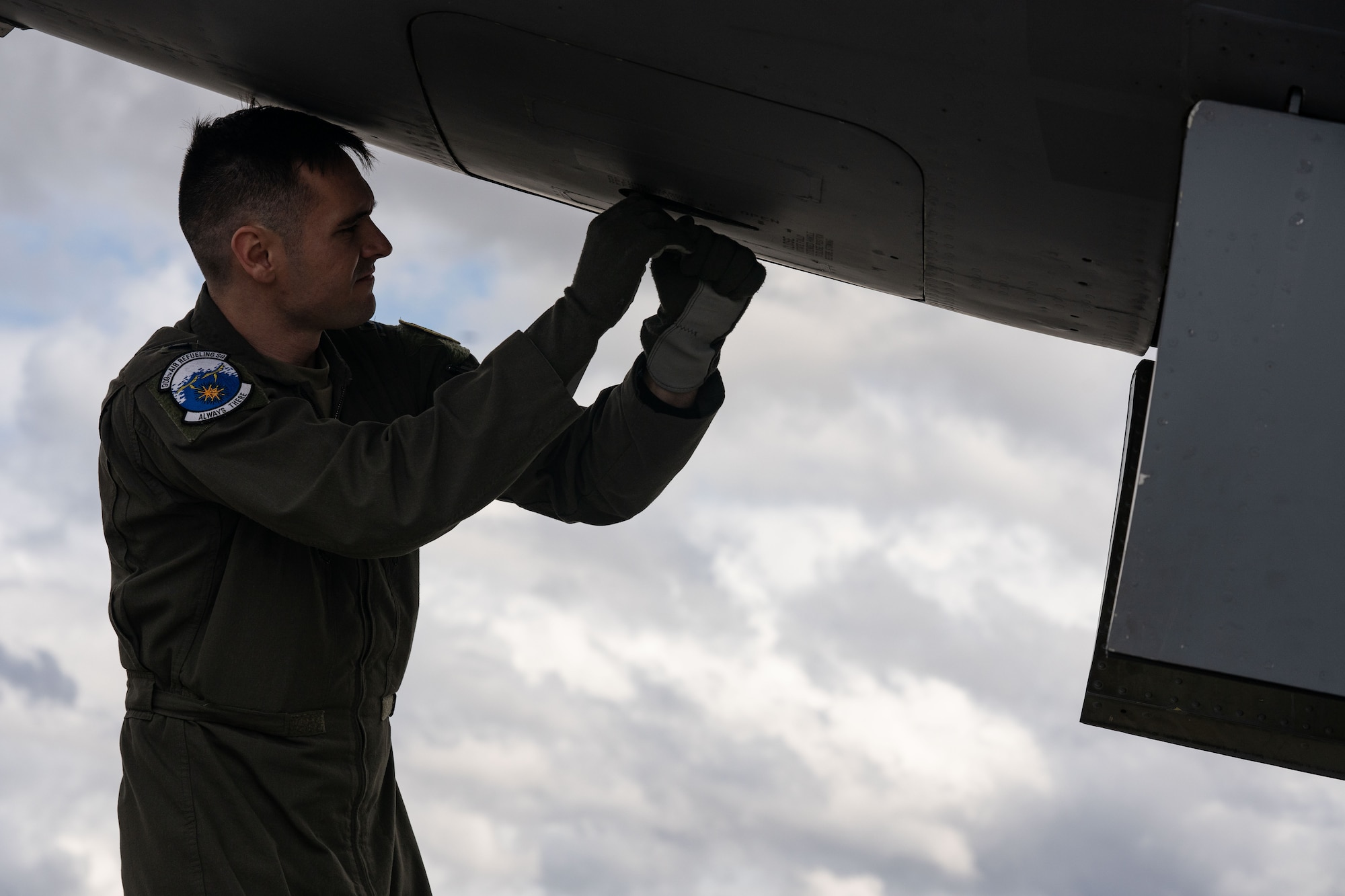 Photo of a pilot conducting a pre-flight inspection