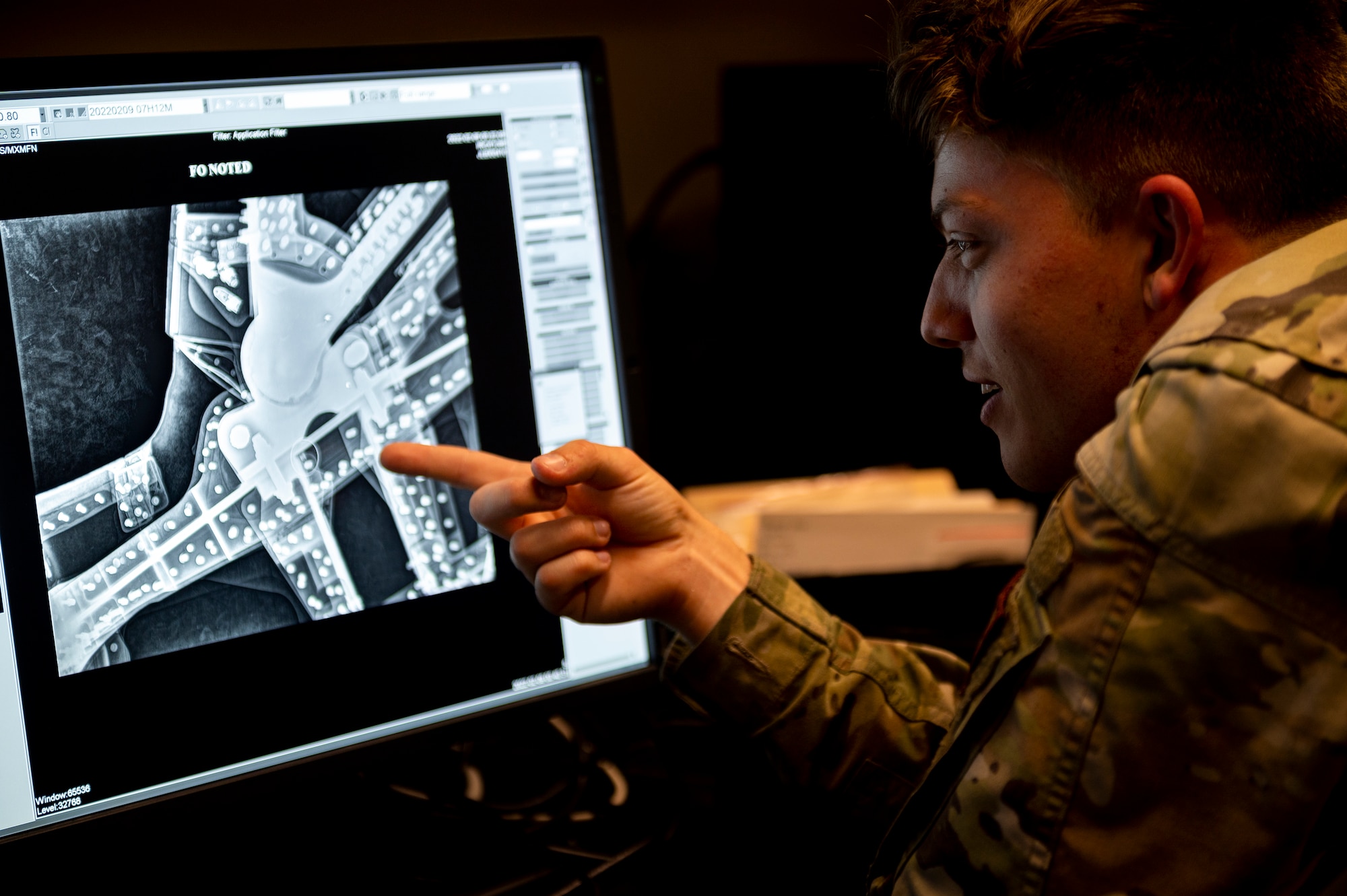 Watt reviewed the x-ray of an F-15E Strike Eagle to ensure the interior doesn’t contain foreign objects or debris. (U.S. Air Force photo by Senior Airman Kylie Barrow)