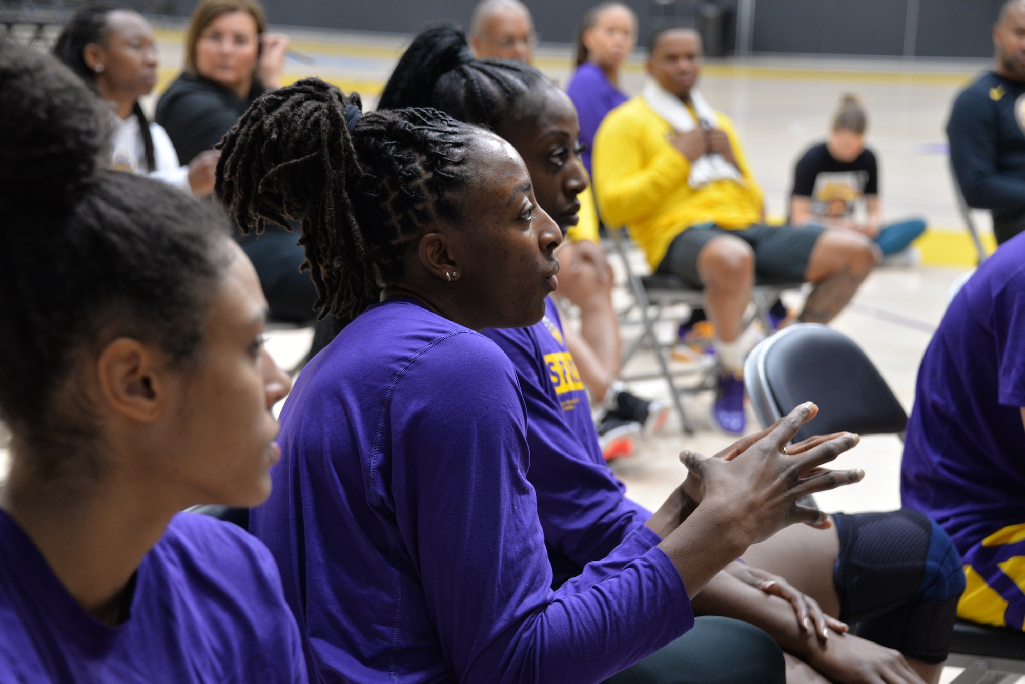 L.A. Sparks forward Nneka Ogwumike, center, asks Col. Krolikowski a question about her experience working in a fast-paced, high-pressure environment. Her sister, Chiney Ogwumike, right, looks on.