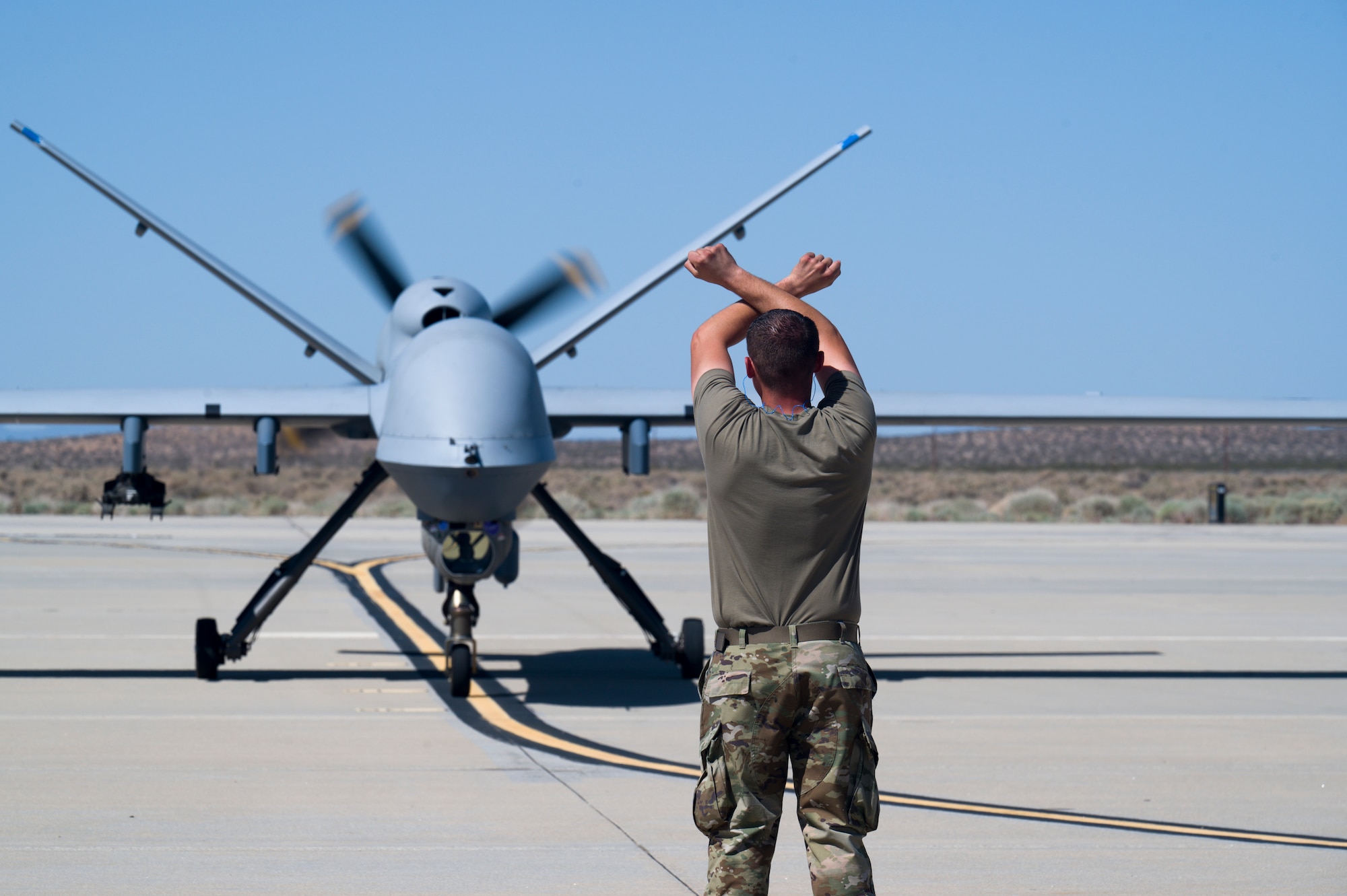 An MQ-9 Reaper from the 163rd Attack Wing, taxis on Edwards Air Force Base, California, May 4. The aircraft conducted an Agile Combat Employment (ACE) to a Forward Operating Site (FOS), flying from March Air Reserve Base to Edwards Air Force Base. (Air Force photo by Giancarlo Casem)