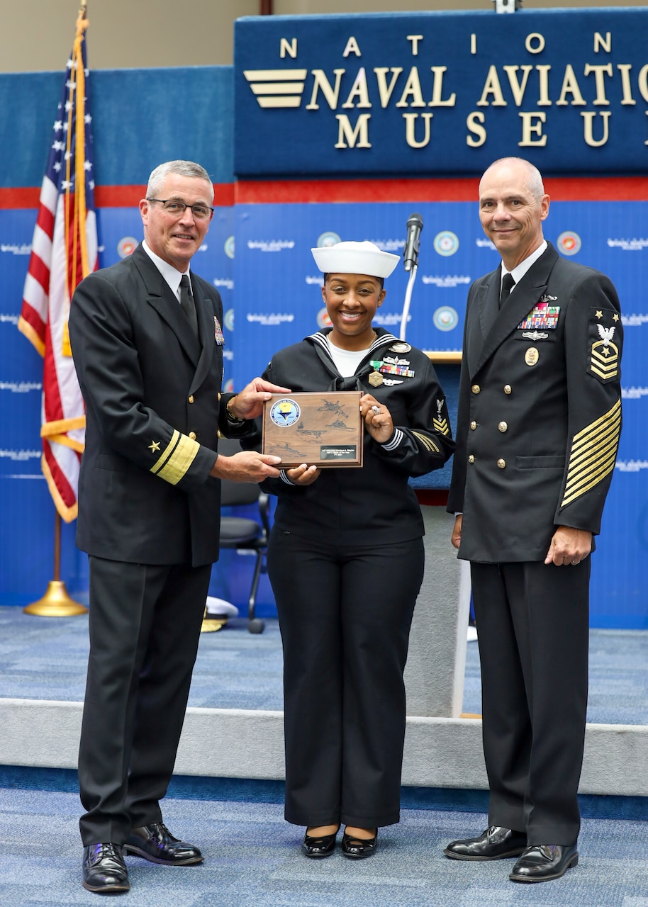 From left, Rear Adm. Pete Garvin, commander, Naval Education and Training Command (NETC), Navy Counselor 1st Class Monique A. Staples, and NETC Force Master Chief Matt Harris pose for a photo following Staples’ selection as the 2021 NETC Sailor of the Year. Staples, a recruiter assigned to Navy Talent Acquisition Group Golden Gate, has been pre-selected for advancement to chief petty officer and will be pinned in the fall.