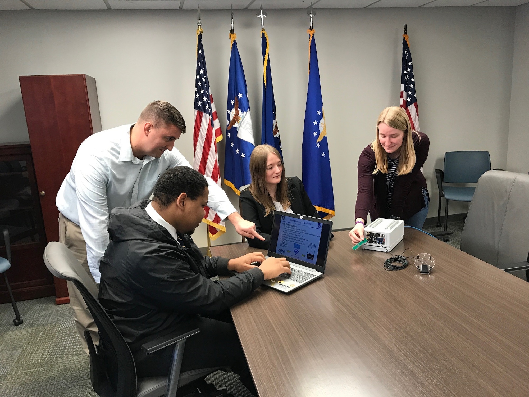 Ryan Wolfarth, Andrew Mitchell, Erin Rogers and Tori Fuenfgeld working on the GeoFence system.