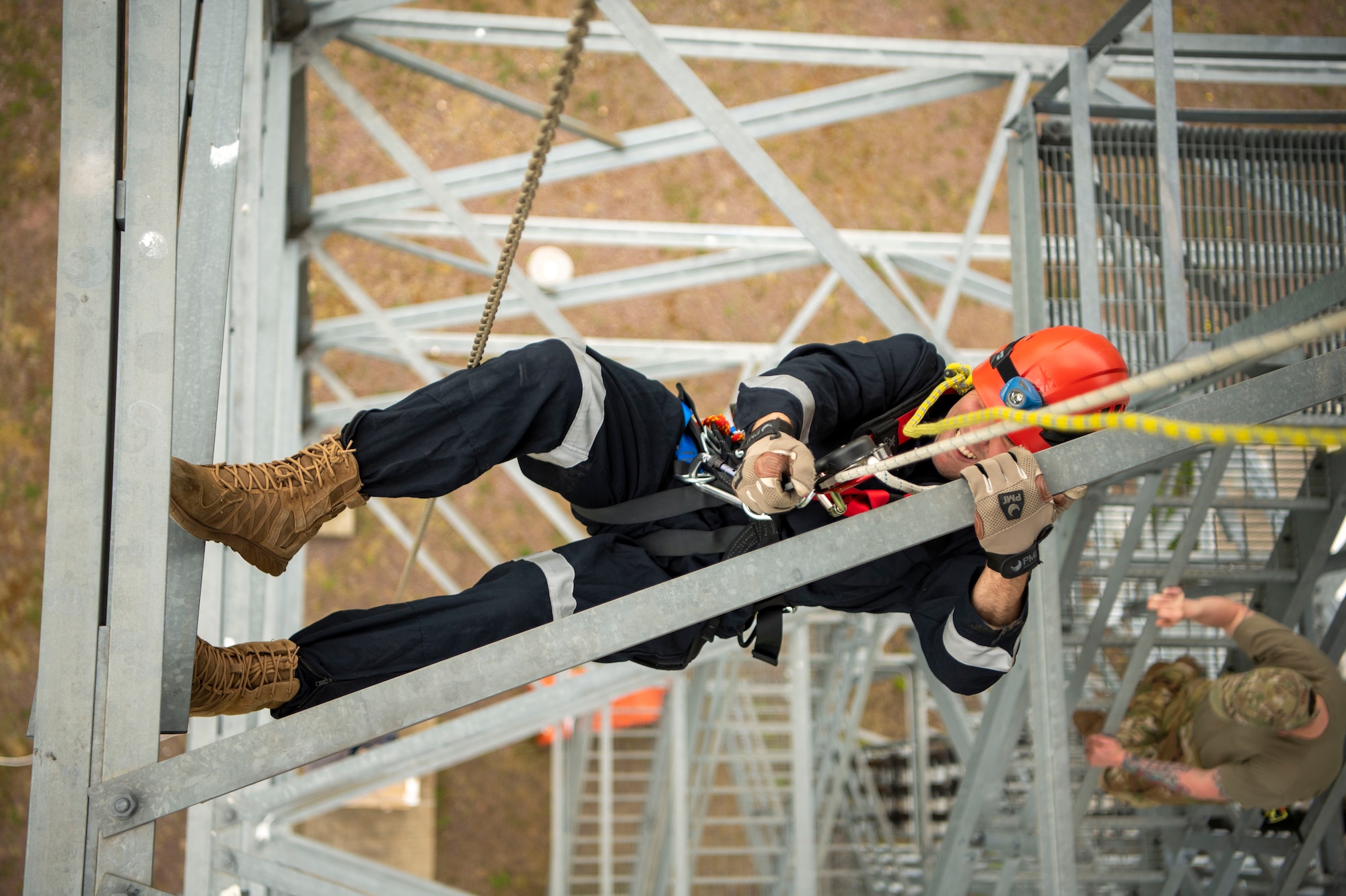 Airman 1st Class Issac Painter, 52nd Civil Engineer Squadron firefighter, rappels down a radar tower during a Fall Rescue demonstration, May 4, 2022, on Spangdahlem Air Base, Germany. Firefighters use rappel operations during dangerous situations requiring rapid entry or exit from buildings. (U.S. Air Force photo by Airman 1st Class Jessica Sanchez-Chen)