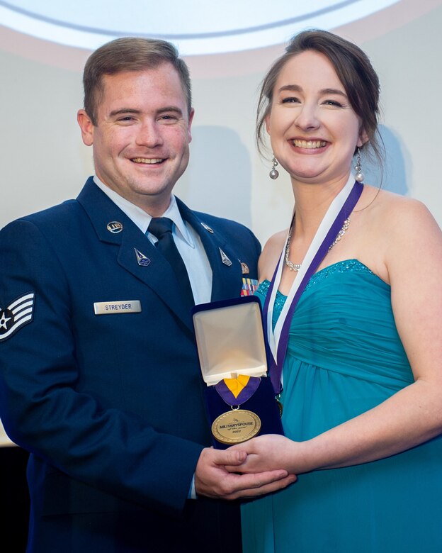 Sarah Streyder, the Armed Forces Insurance Space Force Spouse of the Year, accepts the additional honor of Armed Forces Insurance Military Spouse of the Year during a ceremony in Arlington, Virginia, May 5, 2022. The award was founded in 2008 to recognize the contributions of military spouses. Streyder received the award for her advocacy and voting education efforts, after four rounds of advancement that began in January of this year. (U.S. Air Force photo by Tech. Sgt. Areca T. Wilson/Released)