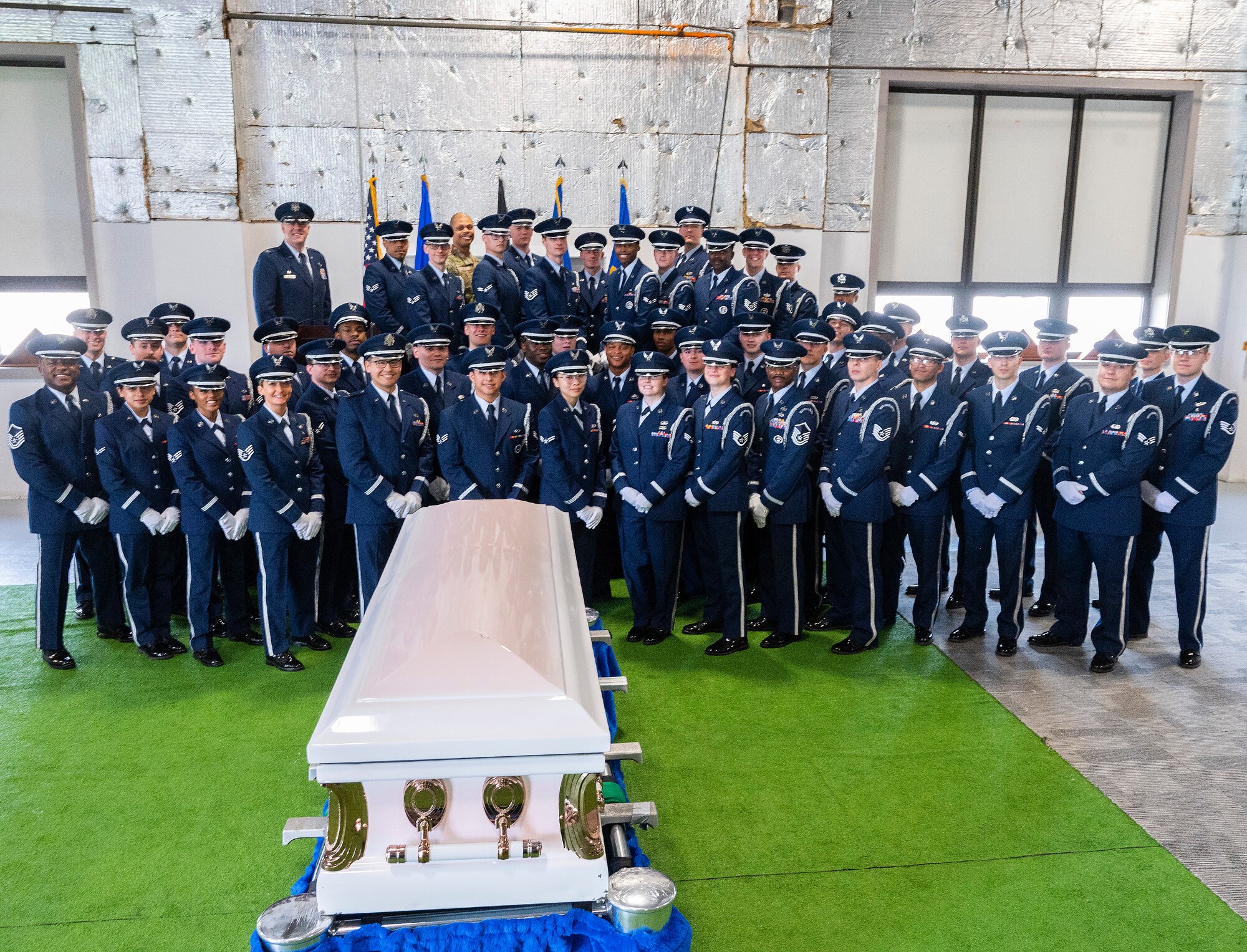 A new class of Wright-Patterson Air Force Base Honor Guardsmen pose with Col. Patrick Miller, 88th Air Base Wing and installation commander (rear left), and their trainers following their graduation ceremony, April 25, 2022. Thirty-nine Airmen from units across the base underwent more than 50 hours of training to become proficient in the customs and courtesies they will need during their six-month tour with the guard. (U.S. Air Force photo by R.J. Oriez)