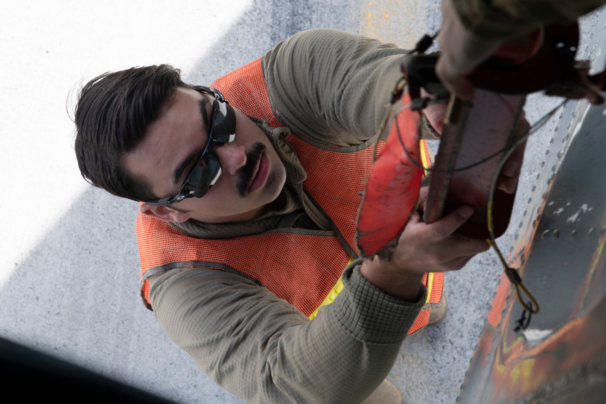 A photo of a fighter aircraft refueling while flying