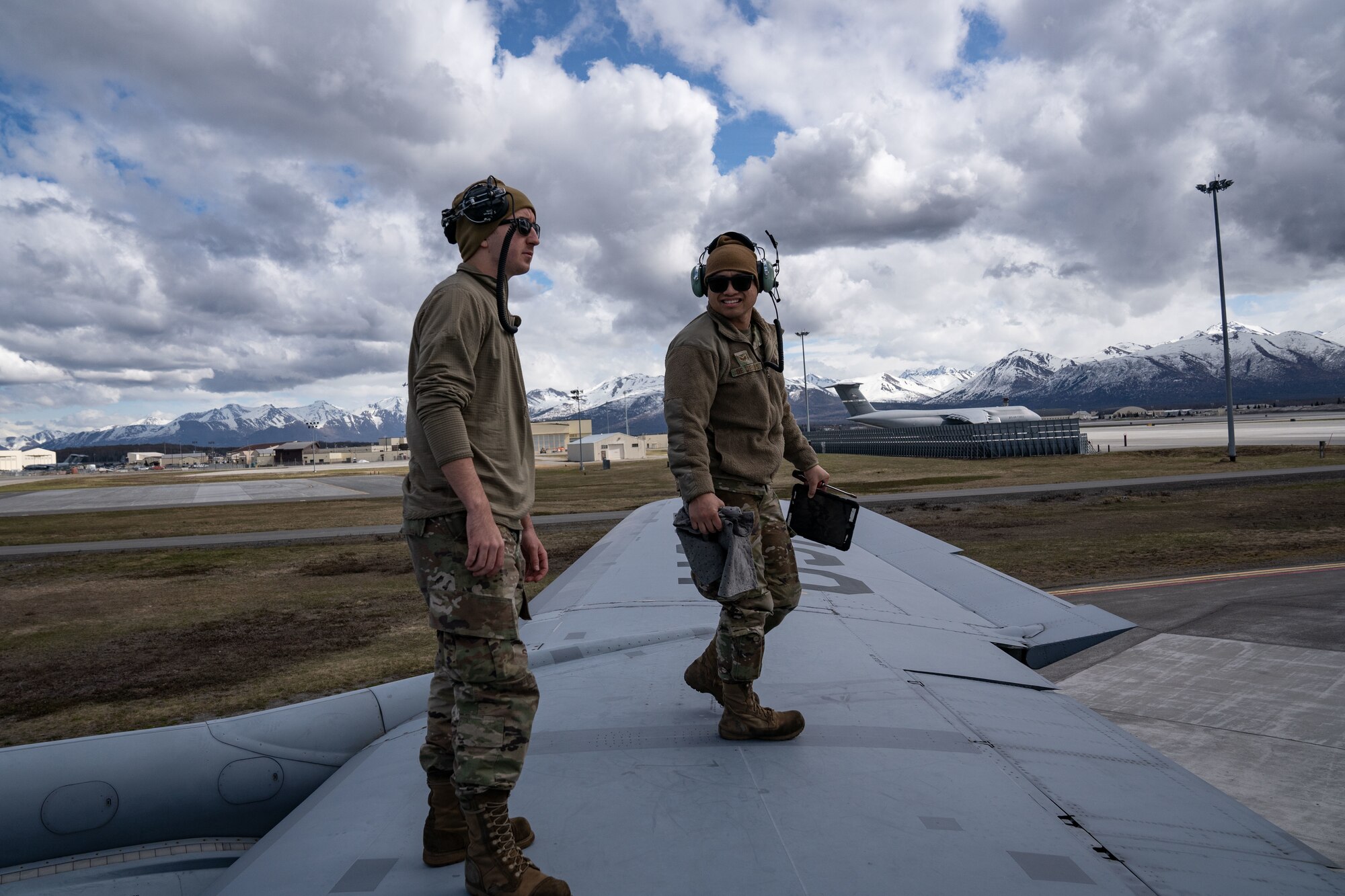 Photo of airmen working on a KC-135 Stratotanker