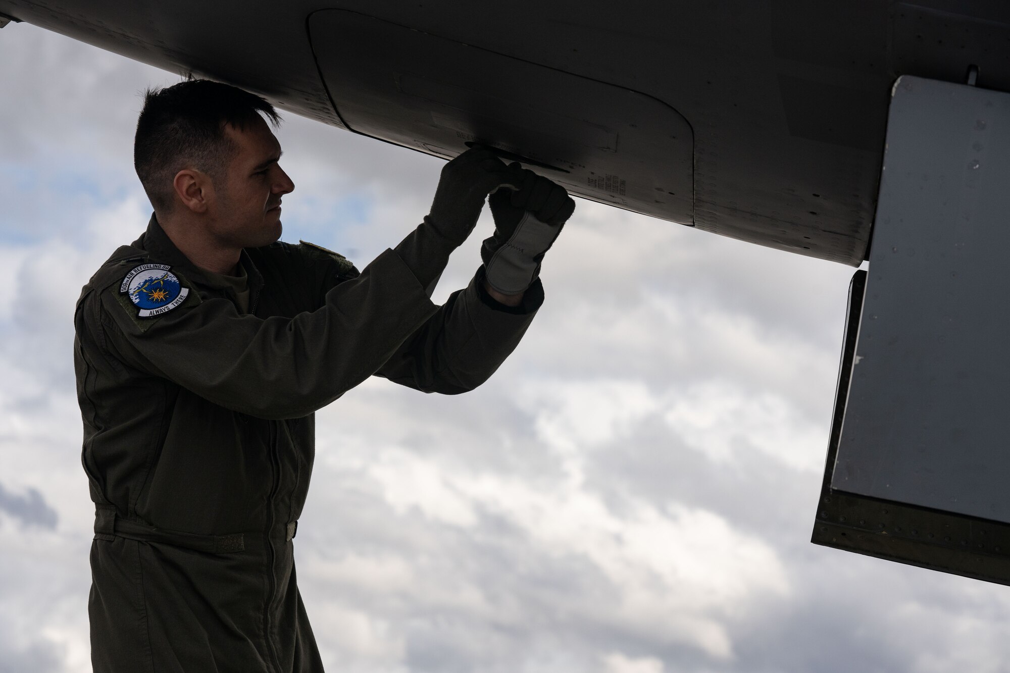 Photo of a pilot conducting a pre-flight inspection