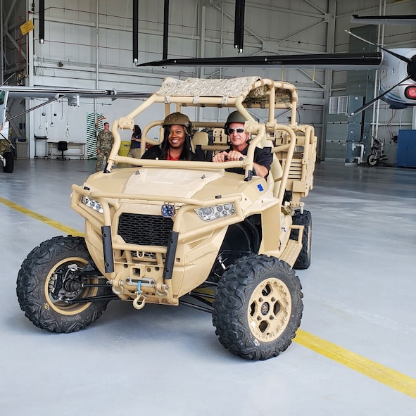 Warner Robins, Georgia, Mayor LaRhonda Patrick and Fire Chief Ross Moulton check out an MRZR all-terrain vehicle as part of Air Force Reserve Command's civic leader advisory group tour at Duke Field, Florida. (Courtesy photo)