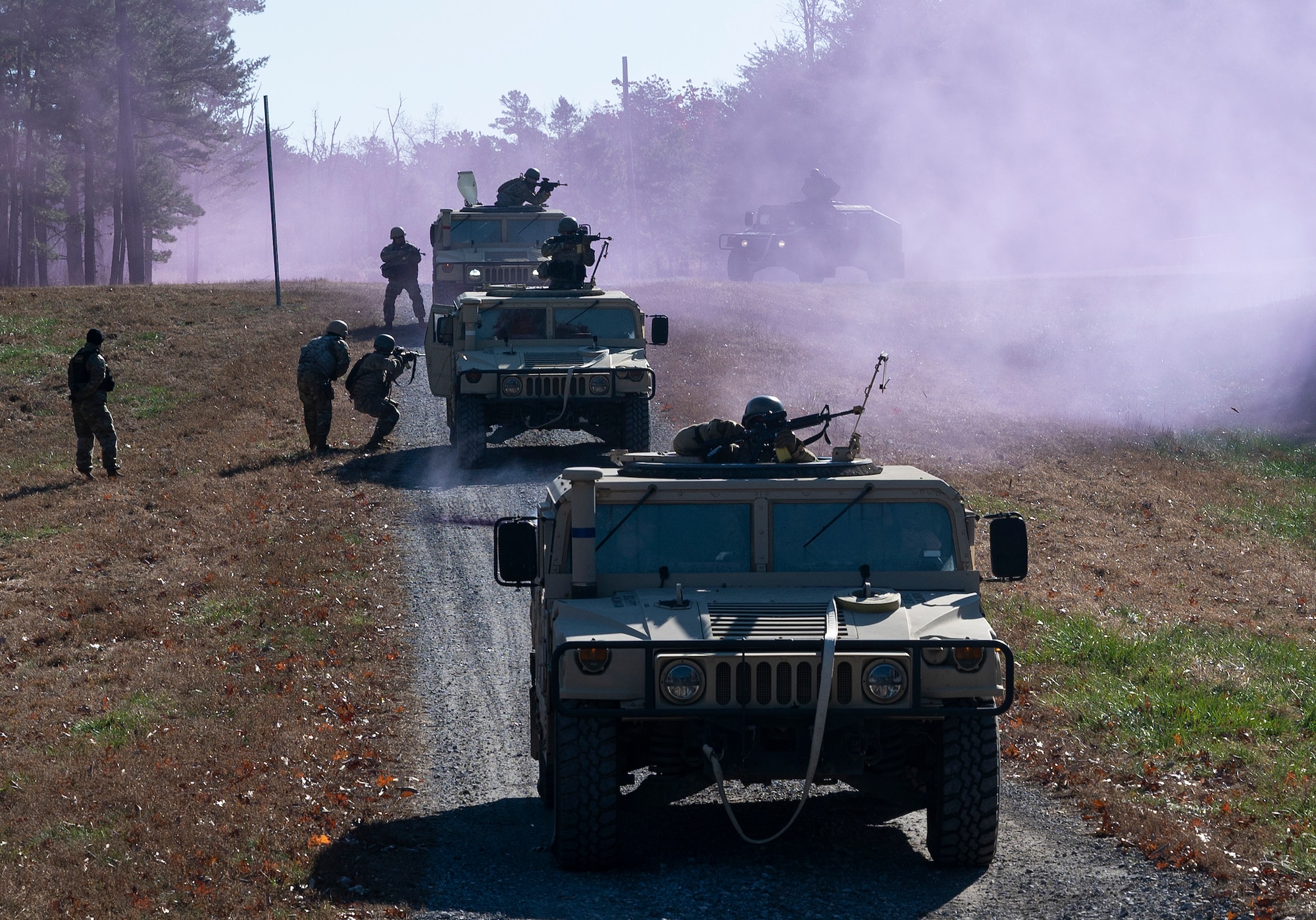 U.S. Air Force Field Craft Hostile students engage with hostile forces during a field training exercise at Joint Base McGuire-Dix-Lakehurst, New Jersey, Nov. 19, 2021. FCH is a pre-deployment course directed by the 421st Combat Training Squadron, that teaches basic combat skills to over 5,000 U.S. Air Force, Joint and NATO personnel annually. (U.S. Air Force photo by Senior Airman Bryan Guthrie)