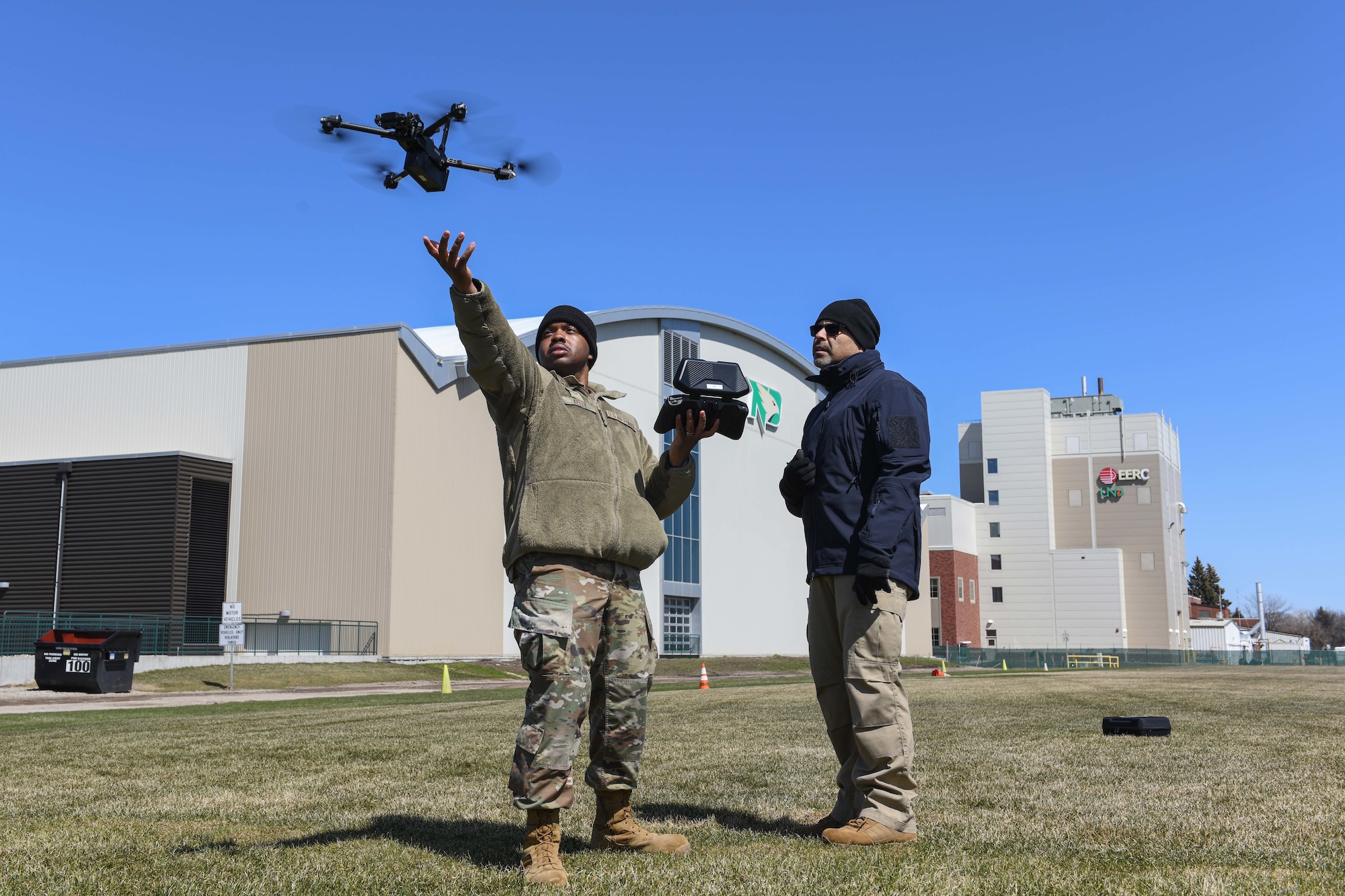 Senior Airman Marcus Kelly, 319th Security Forces Squadron base defense operations center controller, practices a drone landing during an unmanned aircraft system flight training course at the University of North Dakota, Grand Forks, North Dakota, April 27, 2022. Over the course of three days, members familiarized themselves with the drone features to potentially conduct daily operations more efficiently such as security patrol and incident response mission. (U.S. Air Force photo by Senior Airman Ashley Richards)