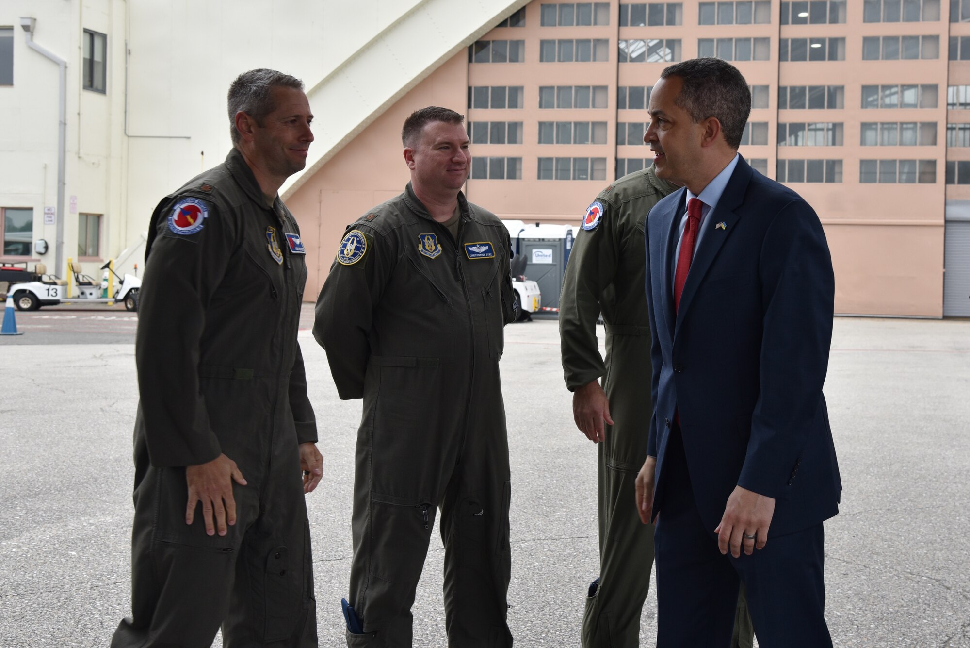 Air Force Reserve members greet Mr. Don Graves as he walks to WC-130J Super Hercules.