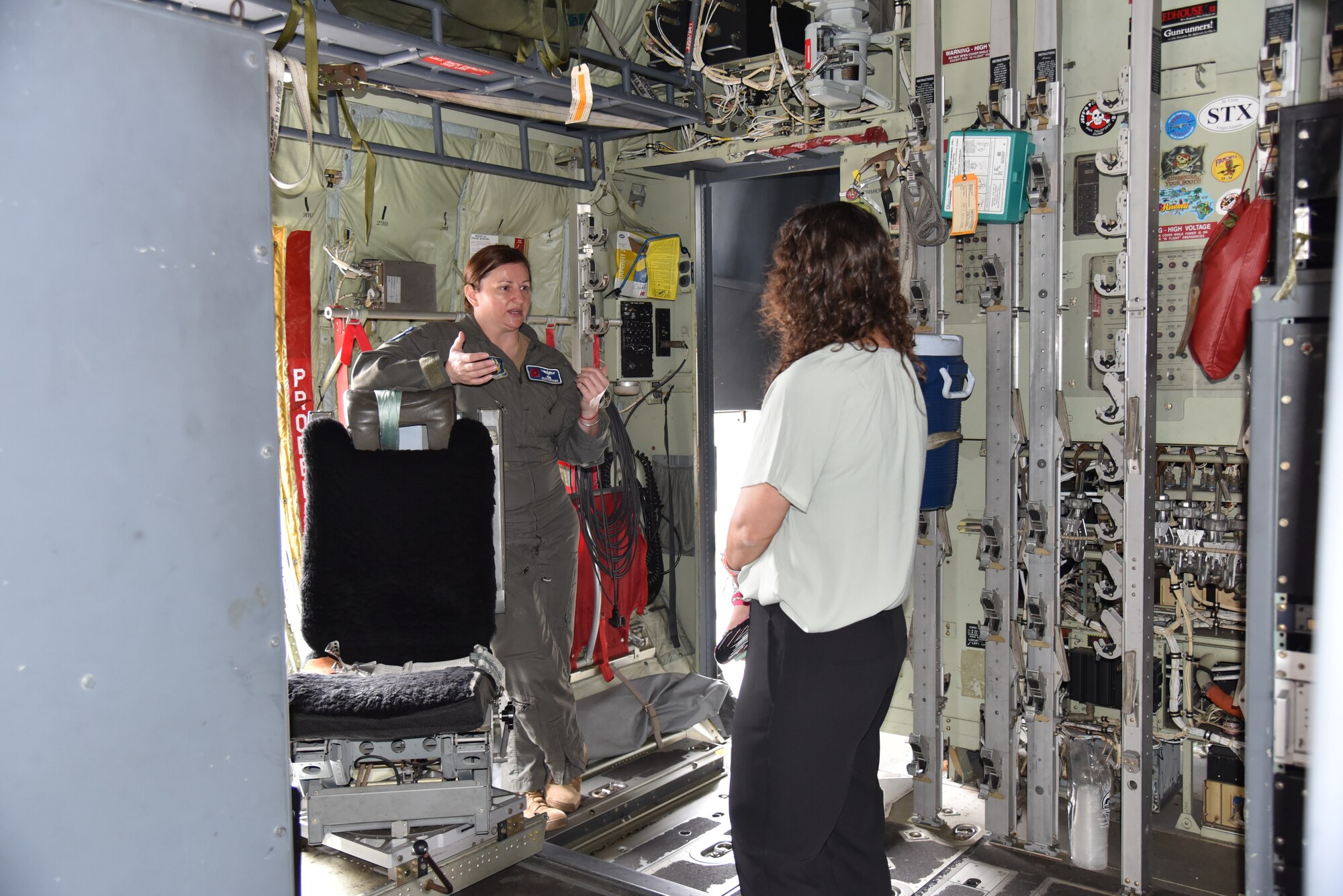 Air Force Reserve navigator talks about flying through a hurricane by the weather officer station of a WC-130J Super Hercules.