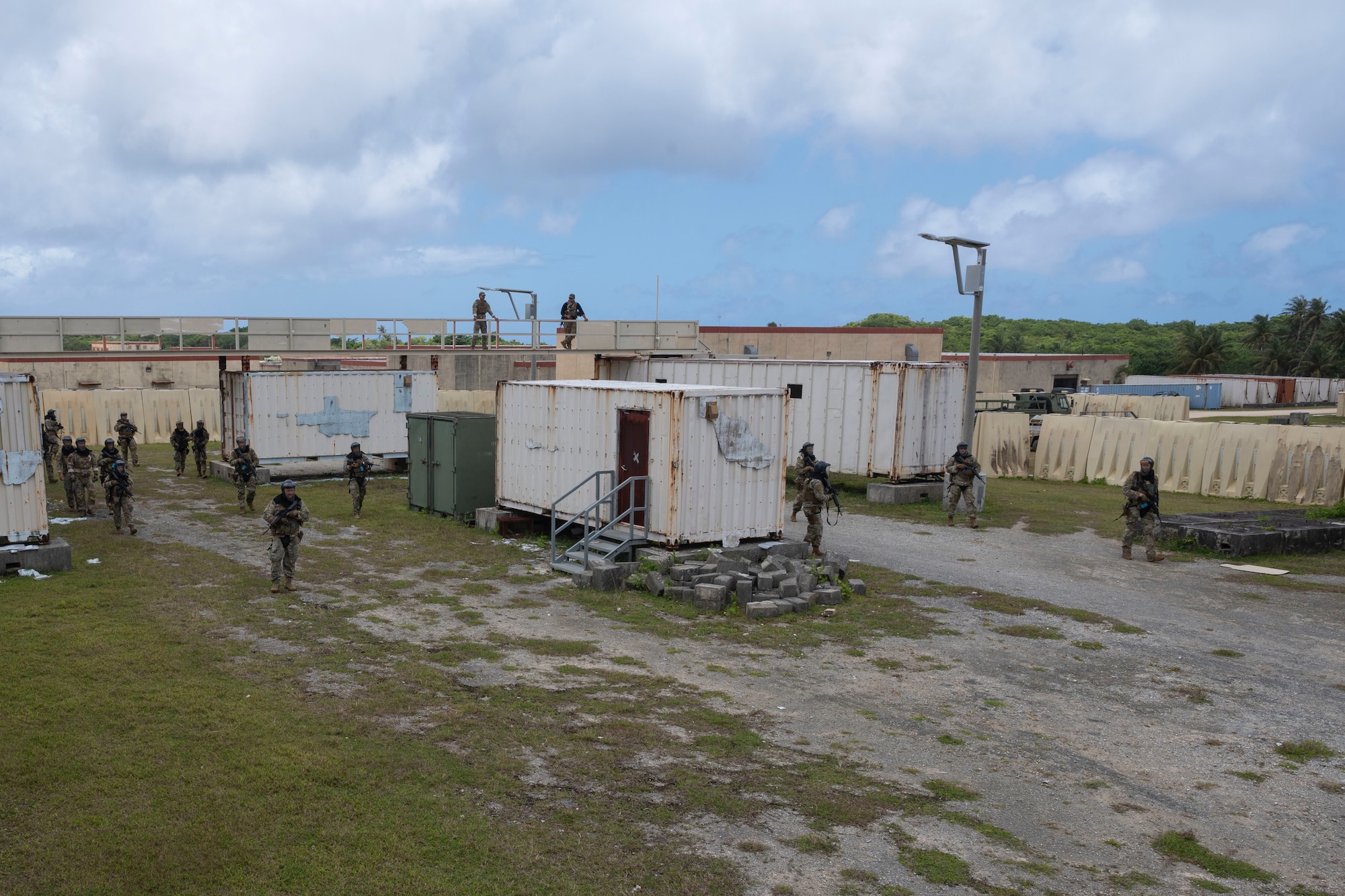 U.S. Air force Airmen with the 736th Security Forces Squadron clear a simulated town of opposing forces during a combat training course at Andersen Air Force Base, Guam, May 3, 2022.