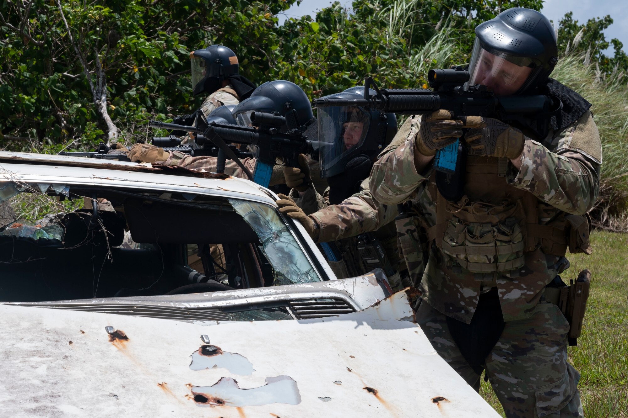 U.S. Air Force Airmen with the 736th Security Forces Squadron watches for opposing forces during a combat training course at Andersen Air Force Base, Guam, May 3, 2022.