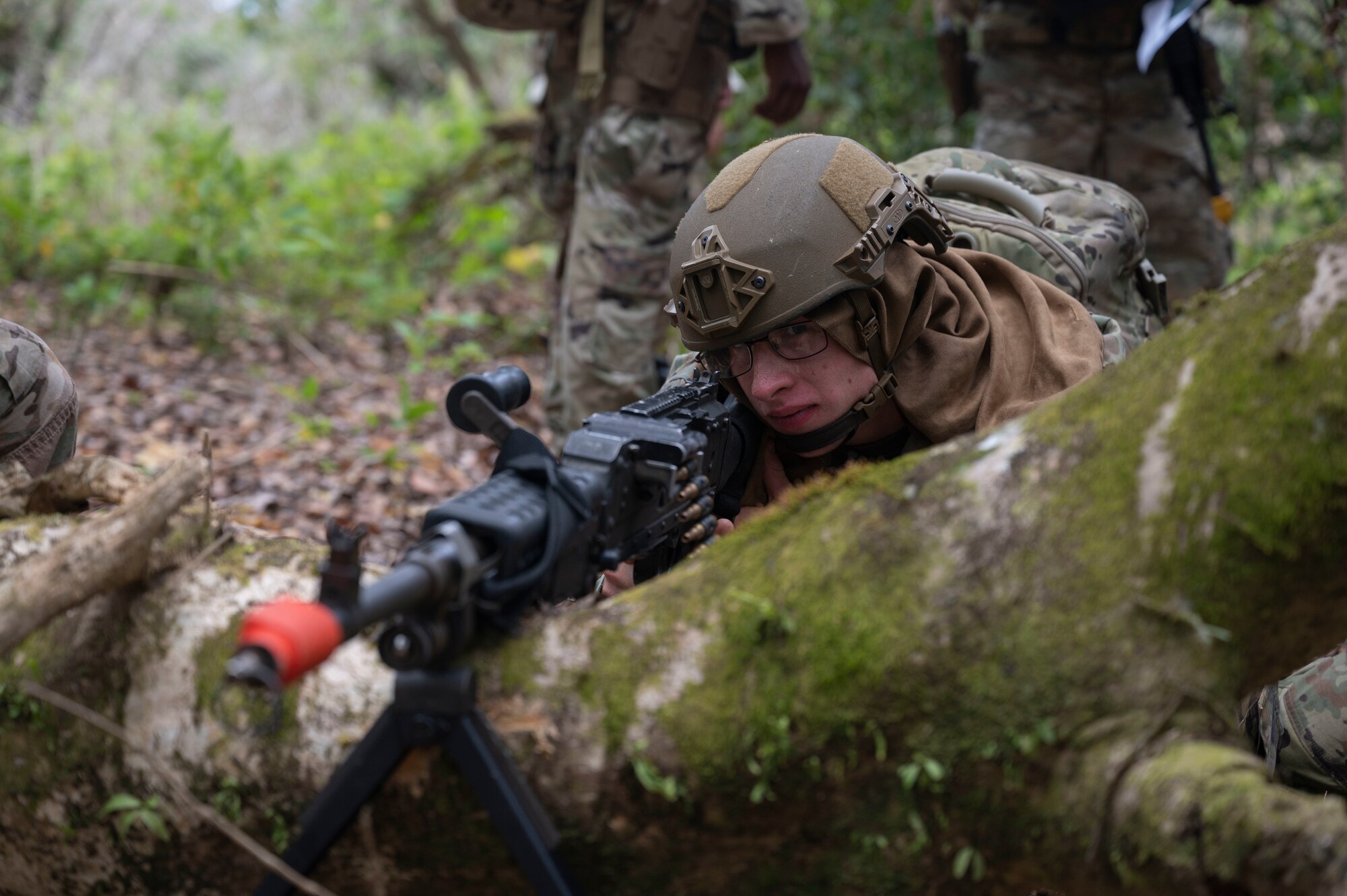 A U.S. Air Force Airman with the 736th Security Forces Squadron watches for opposing forces during a combat training course at Andersen Air Force Base, Guam, May 3, 2022.