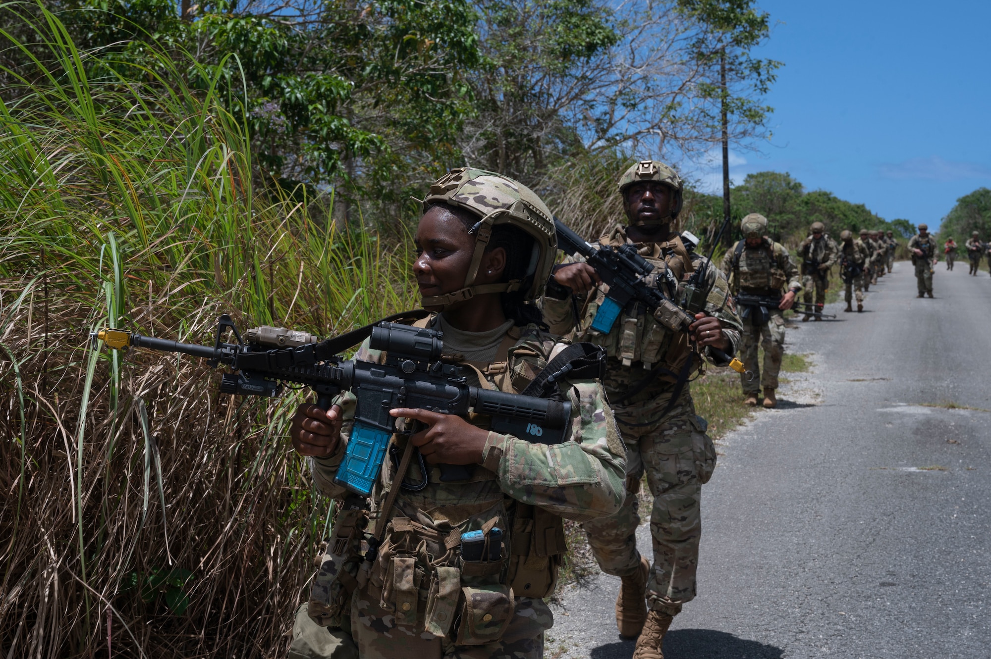 U.S. Air Force Airmen with the 736th Security Forces Squadron walk in a protective patrol during a combat training course at Andersen Air Force Base, Guam, May 3, 2022.