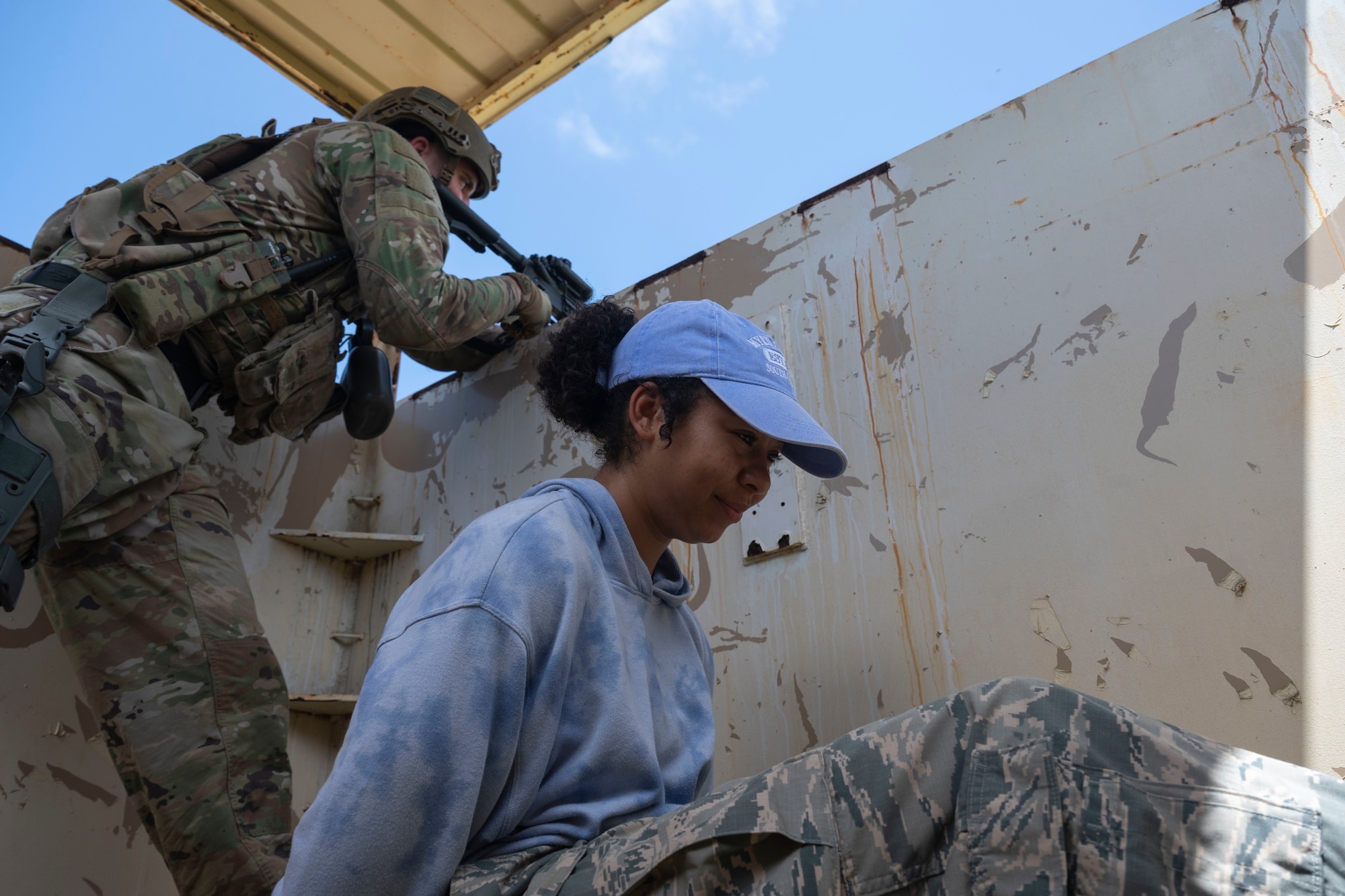 A U.S. Air Force Airman with the 736th Security Forces Squadron guards an opposing force volunteer after clearing a simulated base during a combat training course at Andersen Air Force Base, Guam, May 3, 2022.