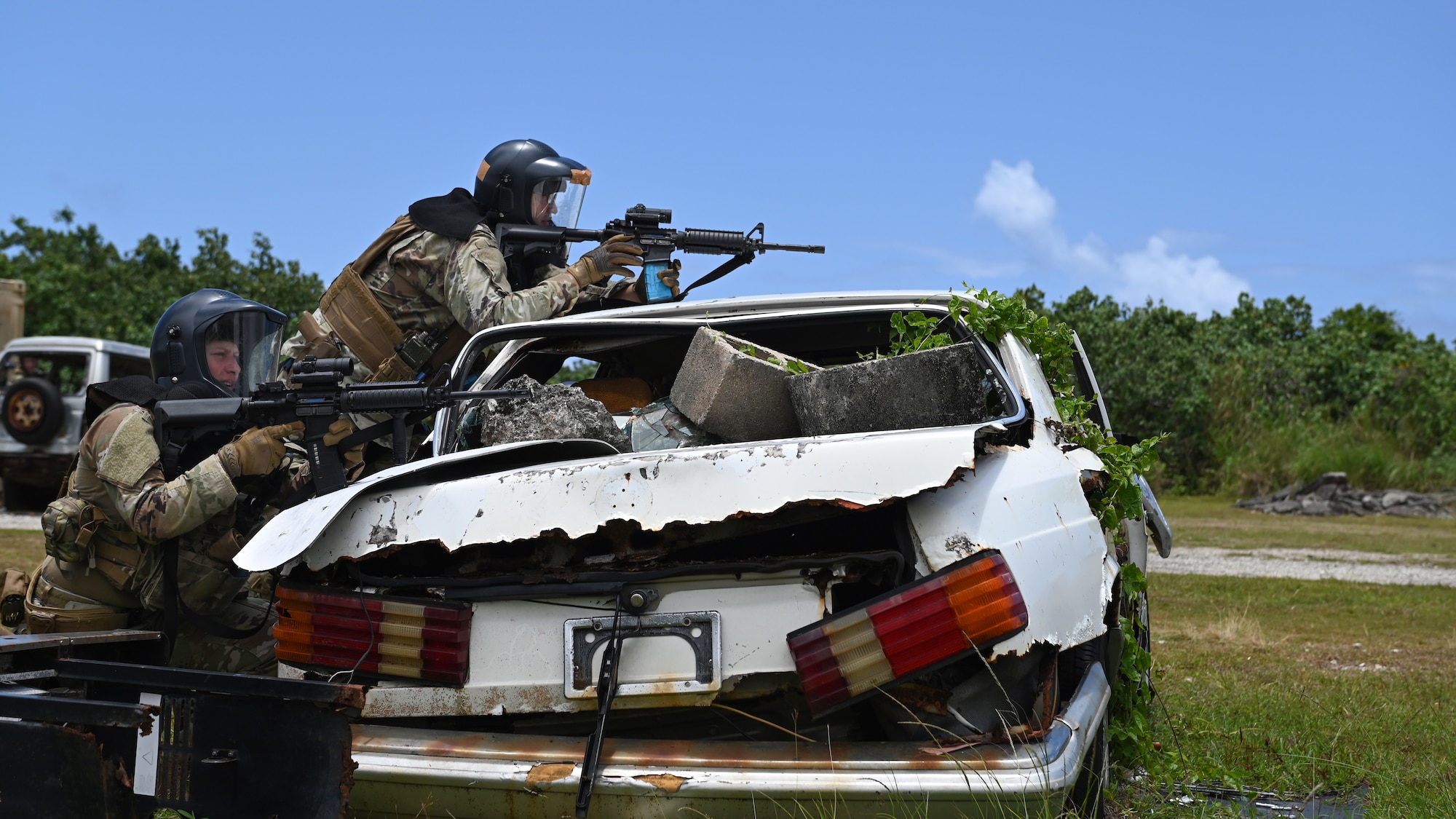 U.S. Air Force Airmen with the 736th Security Forces Squadron shoot sim paint rounds during a combat training course at Andersen Air Force Base, Guam, May 3, 2022.