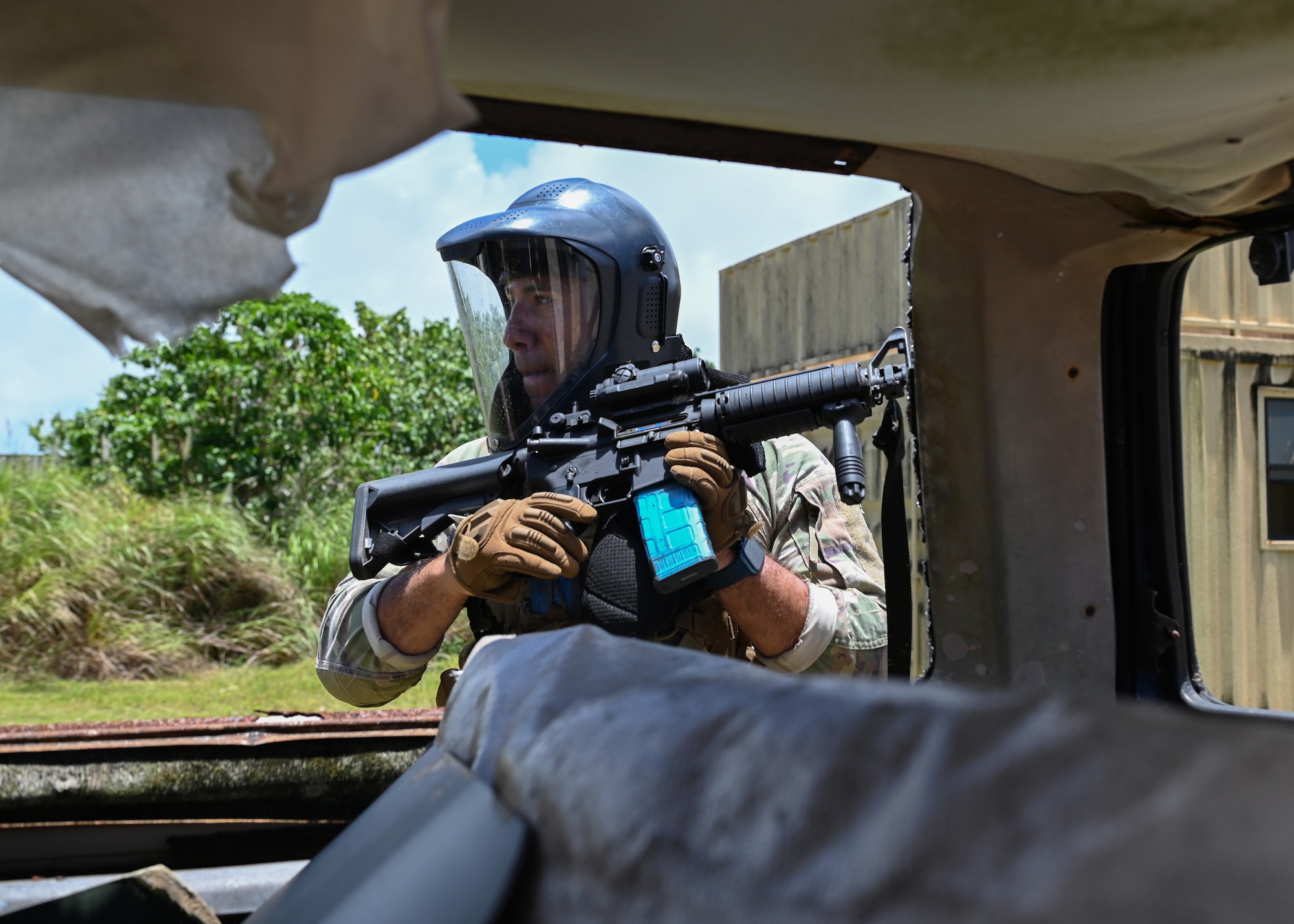 A U.S. Air Force Airman with the 736th Security Forces Squadron exits a simulated town after successfully clearing the buildings of opposing forces during a combat training course at Andersen Air Force Base, Guam, May 3, 2022.
