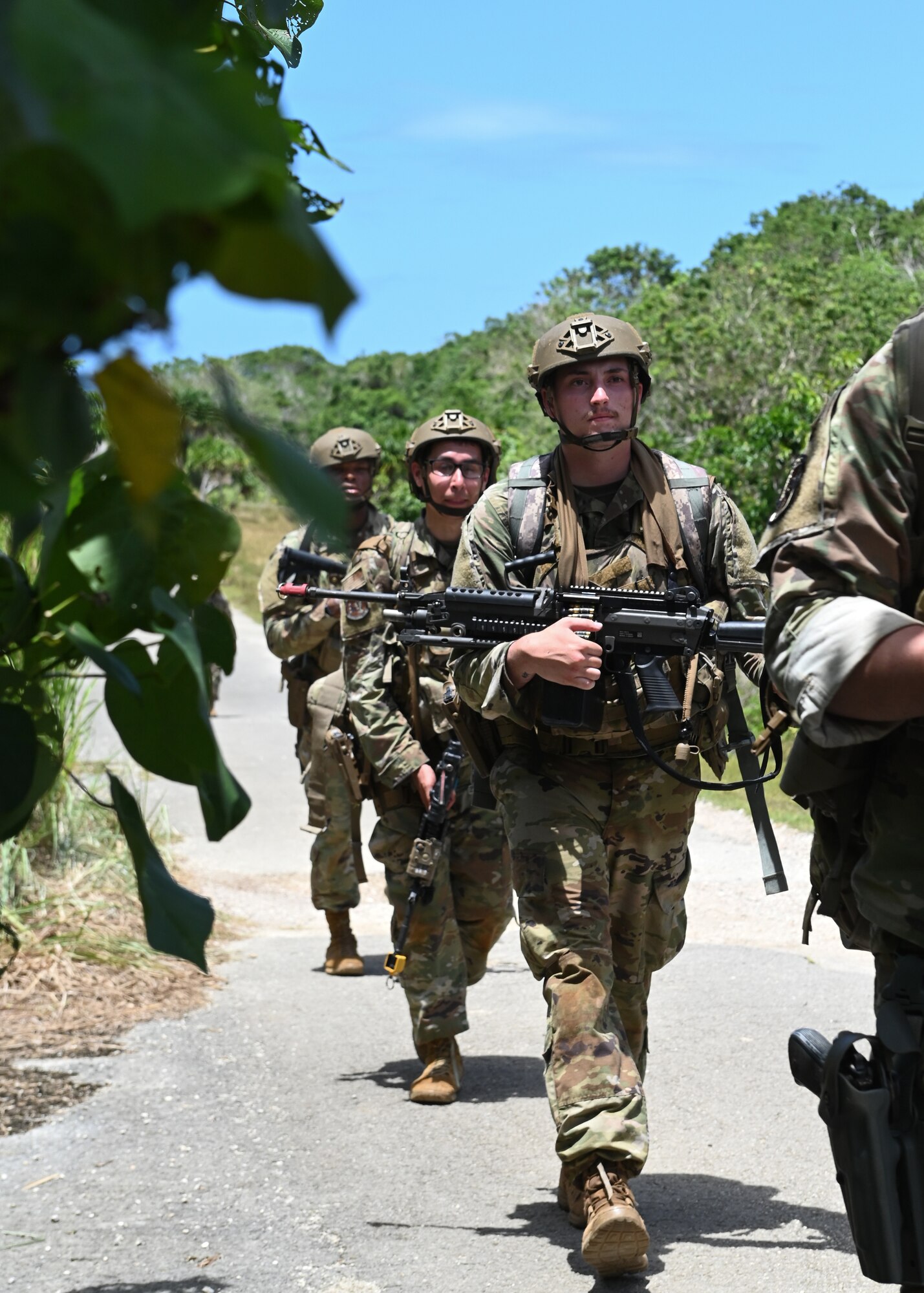 U.S. Air Force Airmen with the 736th Security Forces Squadron walk foot patrol during a combat training course at Andersen Air Force Base, Guam, May 3, 2022.