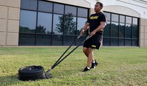 Sgt. 1st Class Byron Barksdale, G-1 noncommissioned officer in charge, U.S. Army Space and Missile Defense Command, performs the sprint-drag-carry event during physical training on May 5, 2022, at the command's Redstone Arsenal, Alabama, headquarters. He is preparing for the Army Combat Fitness Test, which is being implemented in October. (U.S. Army photo by Ayumi Davis)