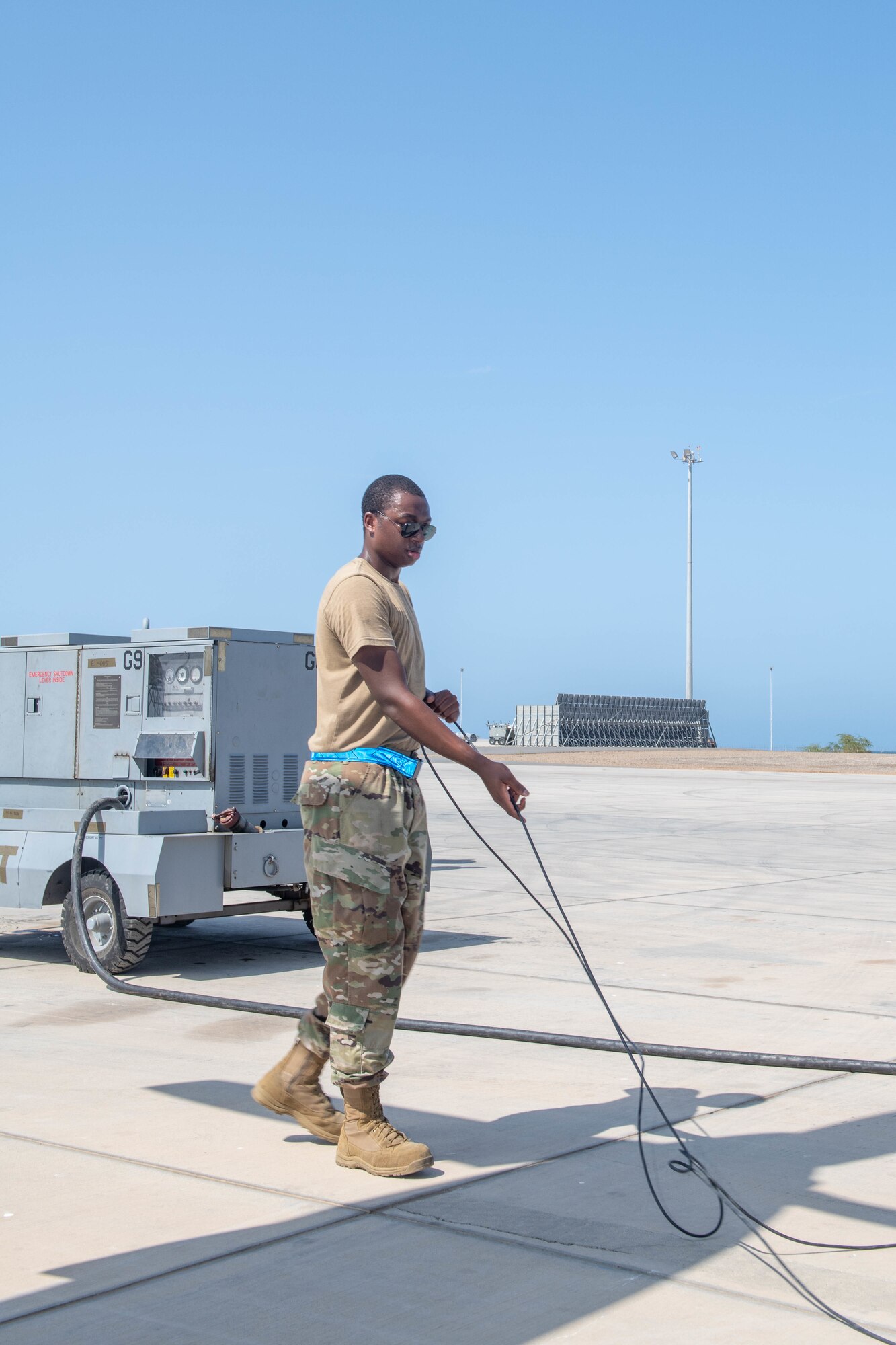U.S. Air Force Reserve Senior Airman Justin Young, an Airman from Youngstown, Ohio, currently deployed to Camp Lemonnier, Djibouti, with the 75th Expeditionary Airlift Squadron "Rogue Squadron", conducts maintenance on a C-130 Hercules assigned to the squadron, May 3, 2022.