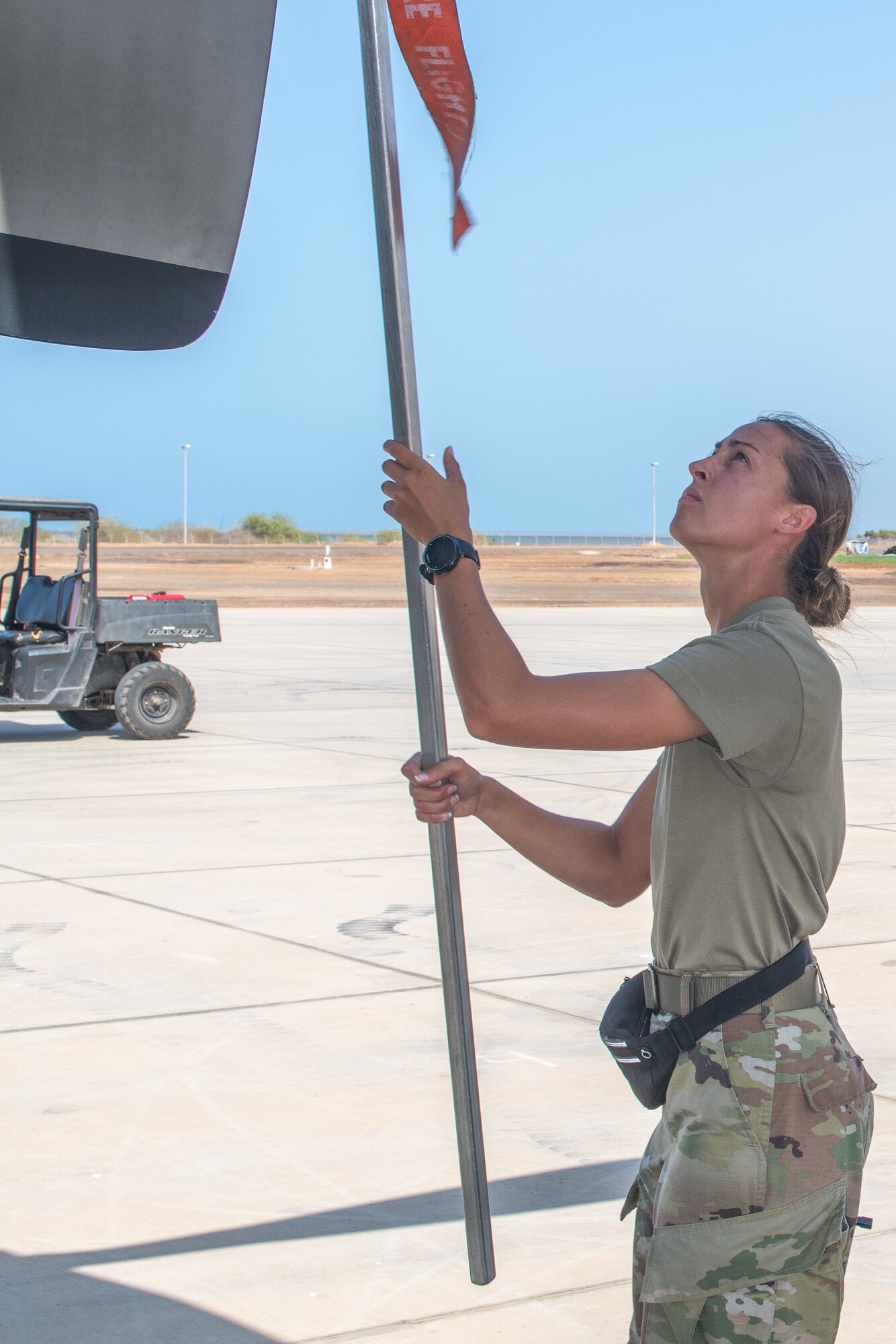 U.S. Air Force Reserve Staff Sgt. Sydnie Schwenk, an Airman from Youngstown, Ohio, currently deployed to Camp Lemonnier, Djibouti, with the 75th Expeditionary Airlift Squadron "Rogue Squadron", conducts maintenance on a C-130 Hercules assigned to the squadron, May 3, 2022.