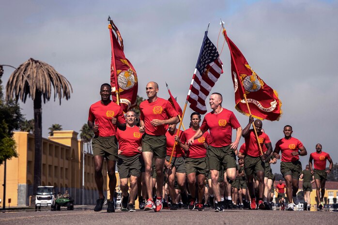 U.S. Marines with Alpha Company, 1st Recruit Training Battalion, participate in a motivational run at Marine Corps Recruit Depot San Diego, May 5, 2022.The staff of Recruit Training Regiment ran at the front of the formation wearing red shirts to represent the battalion they lead. (U.S. Marine Corps photo by Lance Cpl. Cristian G. Torres)