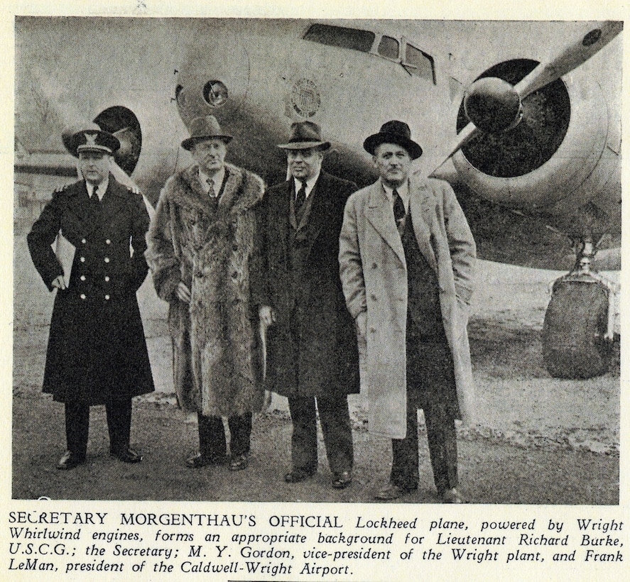 A newsprint photo of Henry Morgenthau & his pilot, LT Richard Burke in front of his CG transport aircraft.