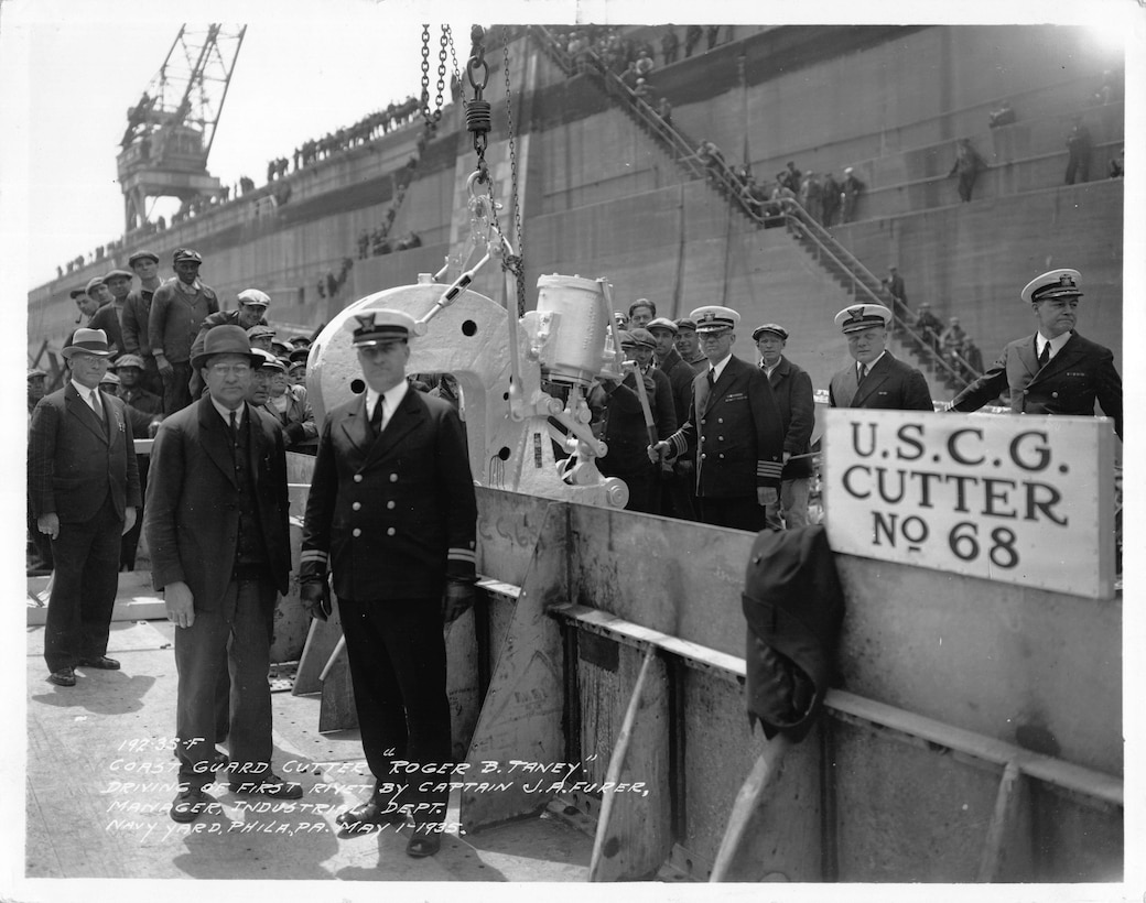 Original caption: "Coast Guard Cutter 'Roger B. Taney' Driving of first rivet by Captain J. A. Furer, Manager, Industrial Dept. Navy Yard, Phila., PA. May 1 1935".