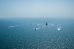 ARABIAN GULF (April 7, 2021) – Royal Bahrain Naval Force fast attack craft RBNS Abdul Rahman Al-fadel (P 22), Bahrain Coast Guard response boats Hawar 5 and Hawar 4, U.S. Navy guided-missile destroyer USS Mahan (DDG 72), patrol coastal ships USS Squall (PC 7) and USS Hurricane (PC 3), U.S. Coast Guard patrol boat USCGC Adak (WBP 1333) and two Mark VI patrol boats operate in formation during exercise Neon Defender in the Arabian Gulf, April 7. Neon Defender 21 is a bilateral maritime exercise between the U.S. and Bahrain, designed to enhance interoperability and readiness, fortify military-to-military relationships and advance operational capabilities, allowing participating naval forces to effectively develop the necessary skills to address threats to regional security, freedom of navigation and the free flow of commerce. (Army Photo by Spc. Evens Milcette Jr.)