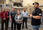 (right)  Naval Surface Warfare Center Panama City Division Craft Pilot Mark Williams, landing craft air cushion vehicle ship-to-shore connector test pilot, briefs members from the Naval Sea Systems Command's Warfare Center Logistics Community of Practice (WFC Log CoP) NSWC PCD tour, April 5-7. The visit also included a tour of the SEAL Delivery Vehicle/MK 18 lab, Mine Countermeasures / Littoral Combat Ship MCM lab, and the Hydrospace lab. (U.S. Navy photo by Eddie Green)