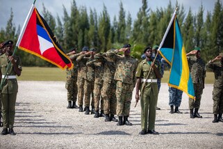 Service members and distinguished visitors from various nations participate in the Opening Ceremony at Price Barracks for Exercise Tradewinds 2022, May, 7 2022.