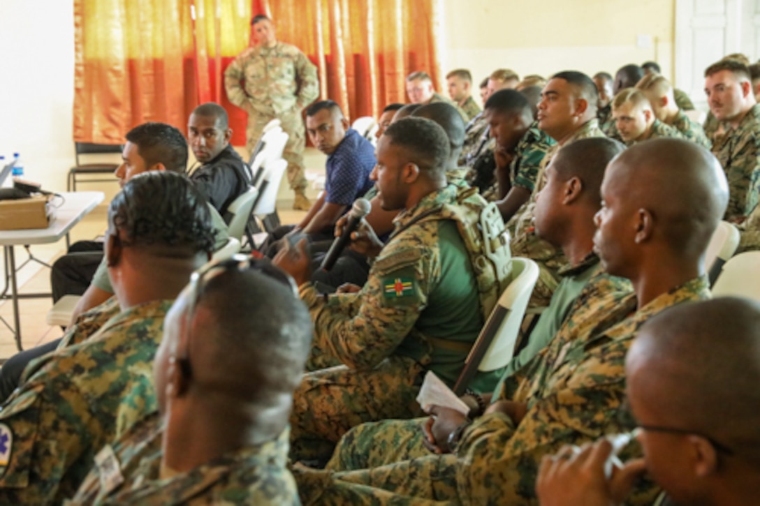 Members of the Dominica nation ask questions during the Human Rights training at Belmopan Police Training Academy a part of Exercise Tradewinds 2022, May 8, 2022.