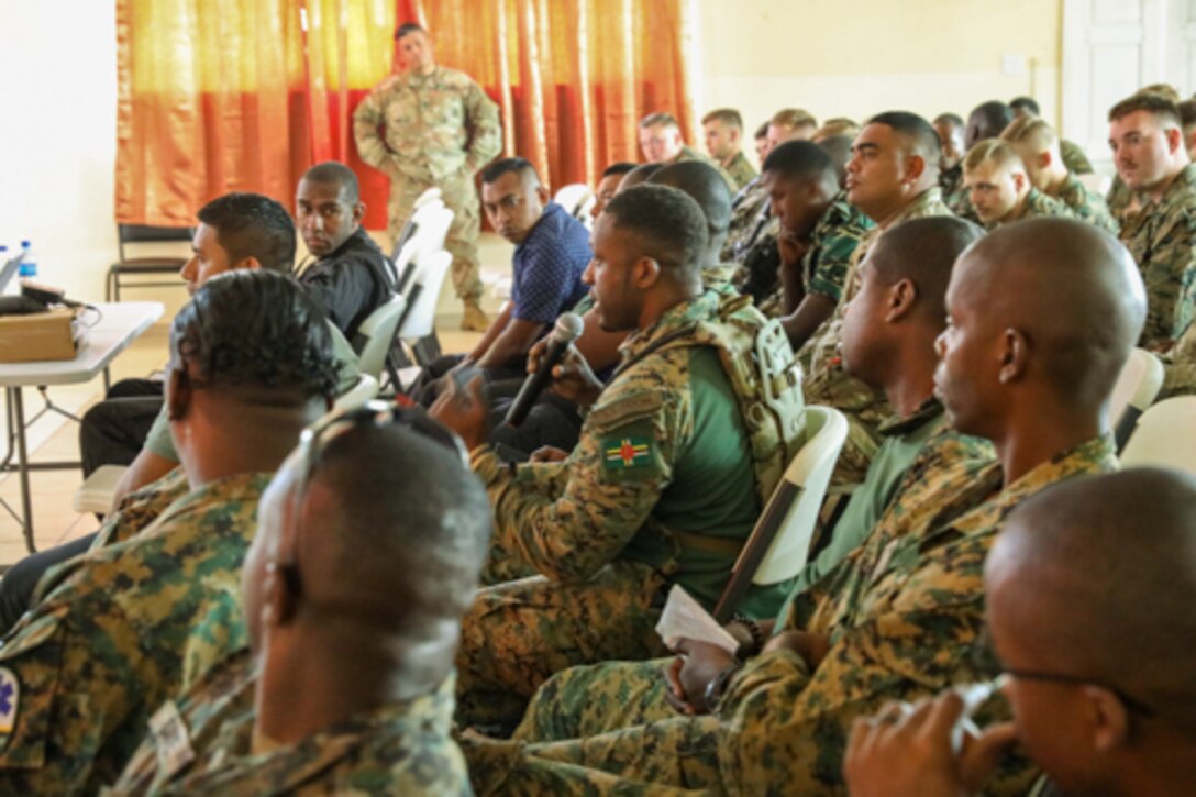 Members of the Dominica nation ask questions during the Human Rights training at Belmopan Police Training Academy a part of Exercise Tradewinds 2022, May 8, 2022.