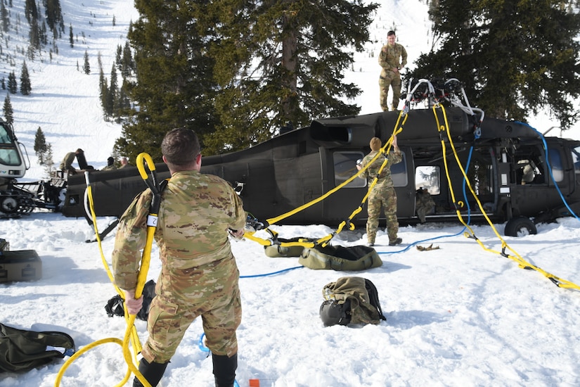 Soldiers work on helicopter