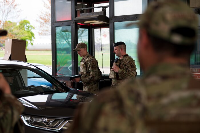 Airman verifies authentications at gate