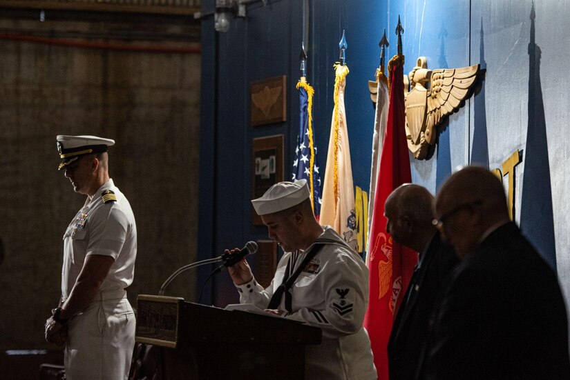 U.S. Navy Religious Program Specialist, 2nd Class Adam Davies provides an invocation during the Hindenburg Memorial Ceremony