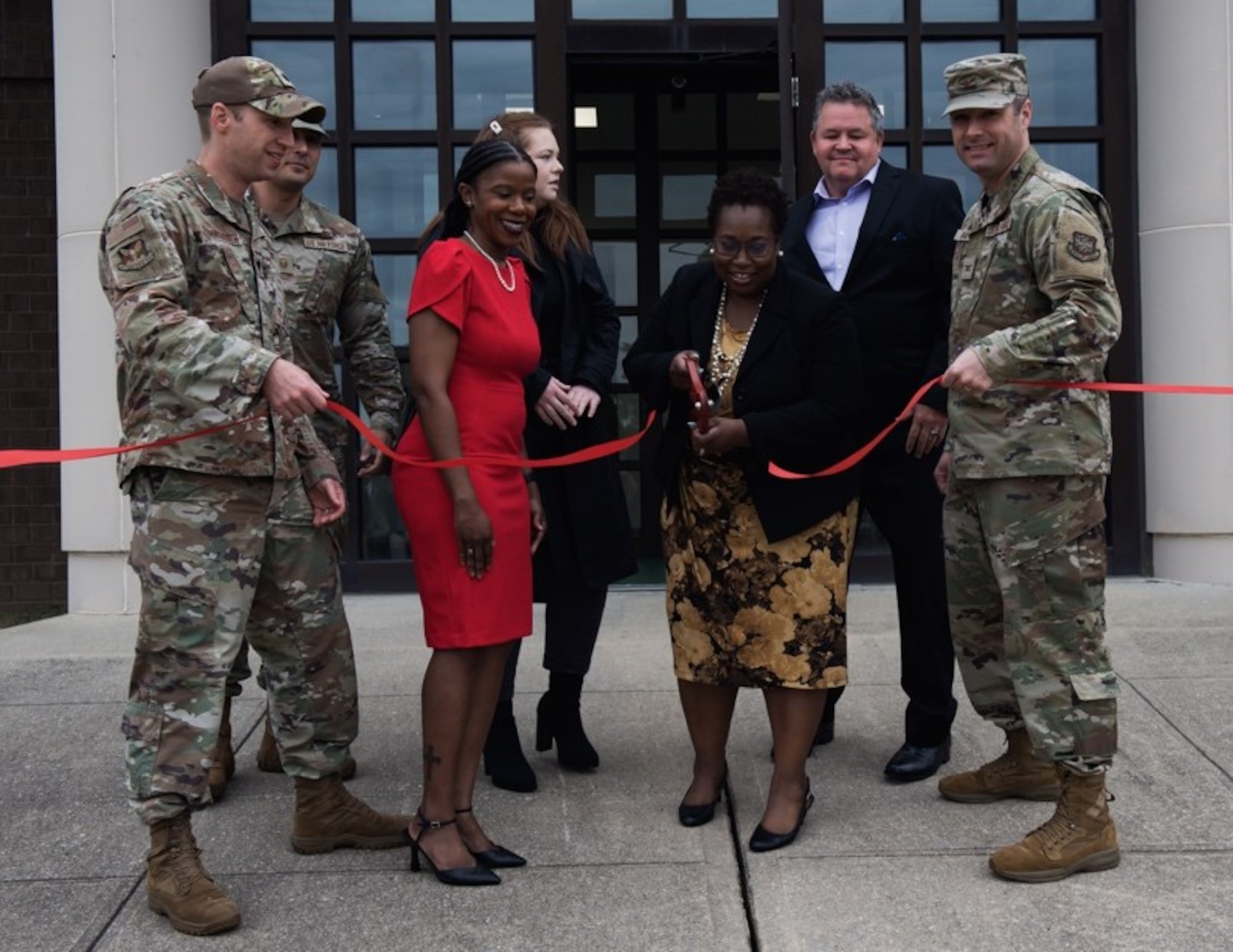 Christina Fletcher, director of STARBASE at Joint Base McGuire-Dix-Lakehurst, N.J, cuts a ribbon signifying the opening of STARBASE on May 5, 2022.