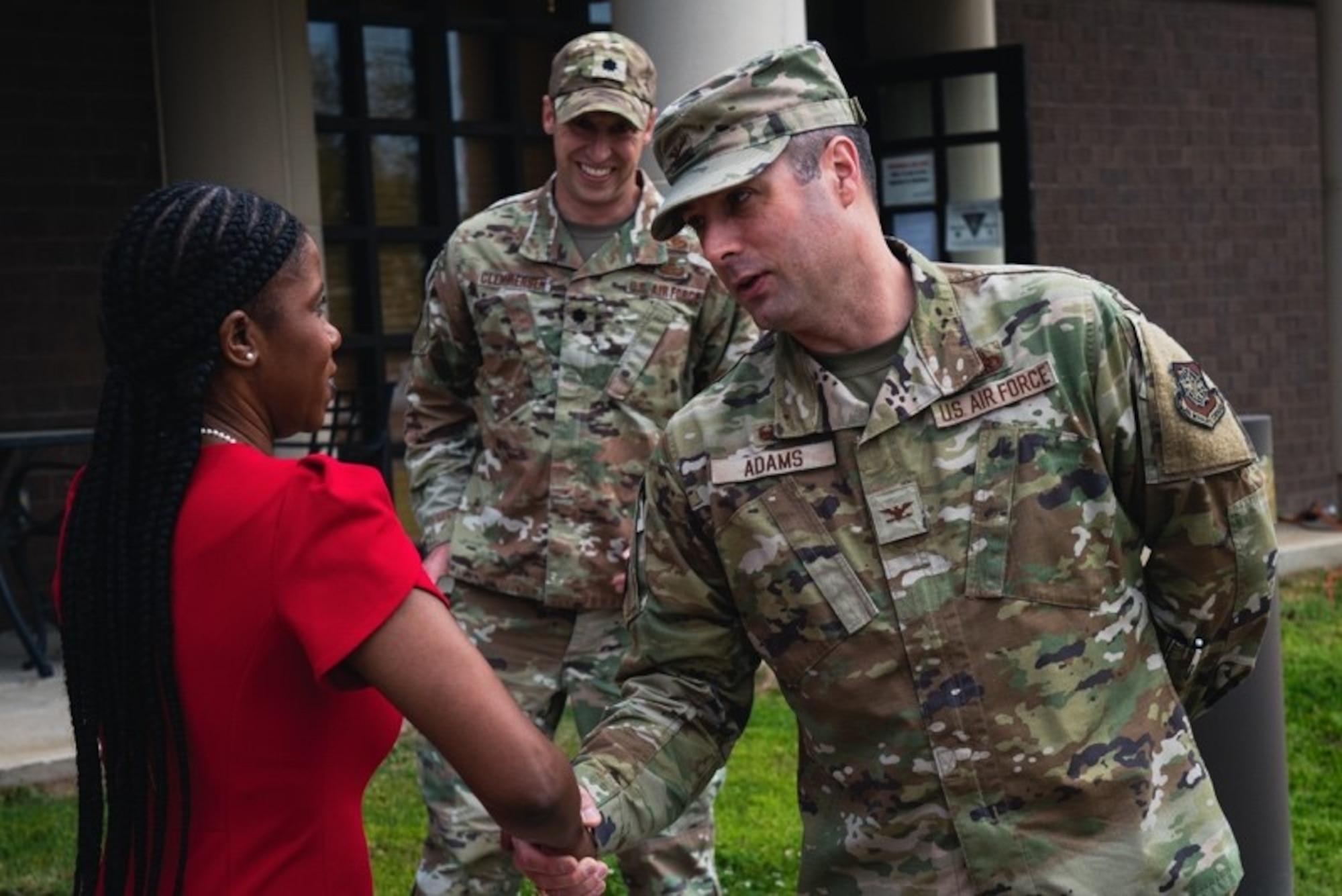 U.S. Air Force Col. Wes Adams, Joint Base McGuire-Dix-Lakehurst commander, coins April Boatner-Allen, school liaison specialist, on Joint Base MDL, N.J., May 5, 2022.