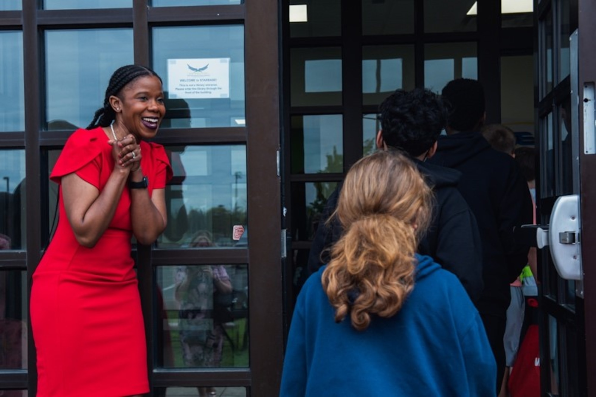 April Boatner-Allen, school liaison specialist, welcomes fifth grade students from Fort Dix Elementary School into the classroom on Joint Base McGuire-Dix-Lakehurst, N.J., May 5, 2022.