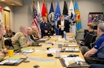 Donovan Phillips, USMEPCOM Chief of Staff, (right) reads the citation for an honorary Hamby award presented to David Hamby, USMEPCOM inspector general (left) during a command and staff meeting, May 6. The Hamby award, usually presented to Soldiers at Fort Irwin, was created in memory of the late U.S. Army Col. Jerrell Hamby, David’s father.