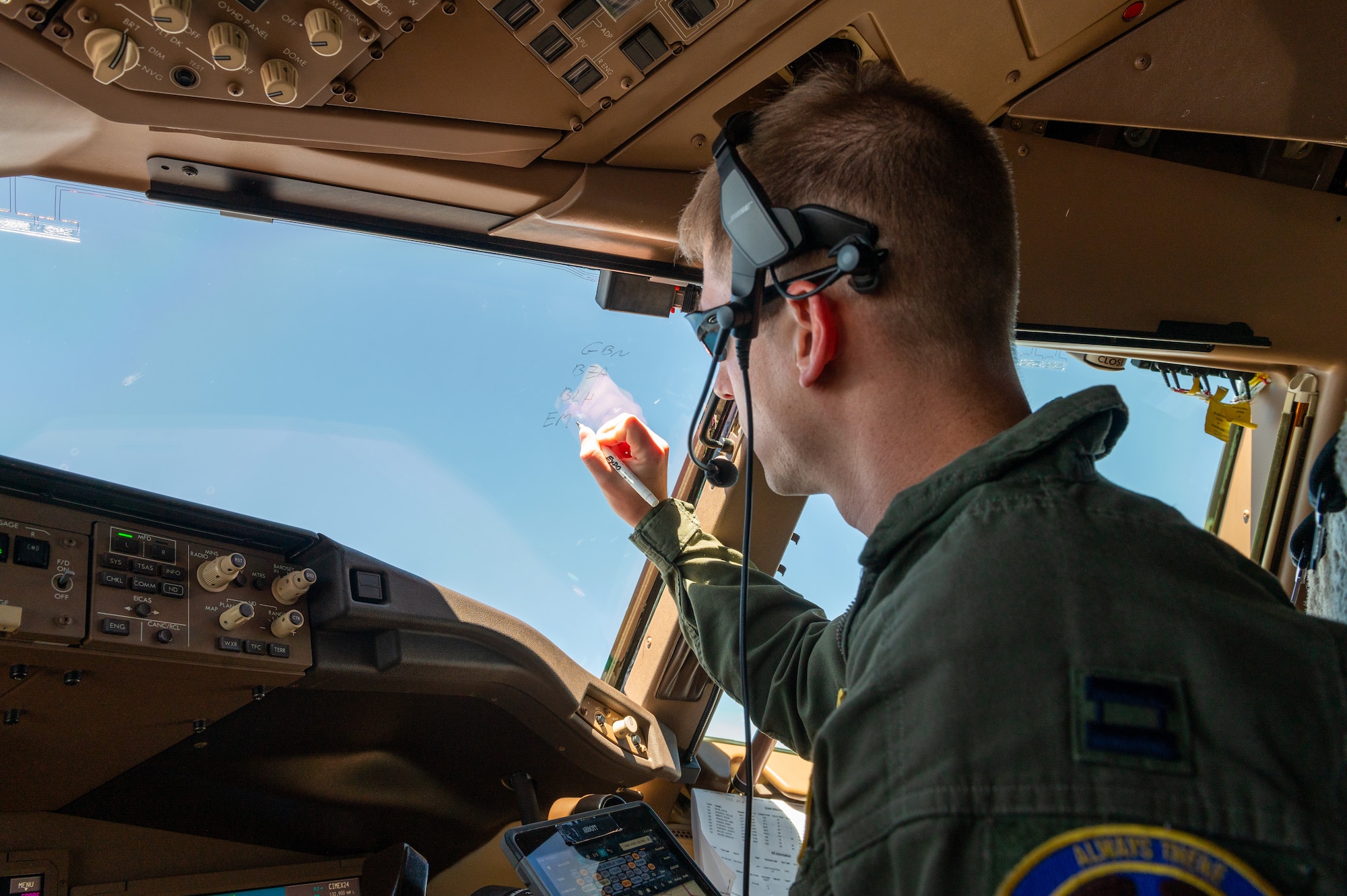 Captain Kevin Abbott, 344th Air Refueling Squadron instructor pilot, coordinates route changes with Los Angeles Air Traffic Control Center May 5, 2022. Route changes were necessary to avoid thunderstorms while still make the air refueling control time with the receivers. (U.S. Air Force photo by Airman Brenden Beezley)