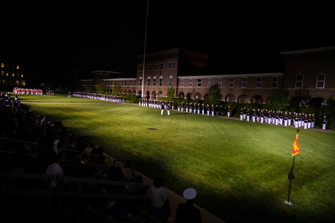 Marines with Marine Barracks Washington perform during a Friday Evening Parade at MBW, April 29, 2022. The guest of honor for the evening was Gen. David H. Berger, the 38th Commandant of the Marine Corps, and the hosting official was Col. Robert A. Sucher, the commanding officer of Marine Barracks Washington. (U.S. Marine Corps photo by Cpl. Mark Morales)