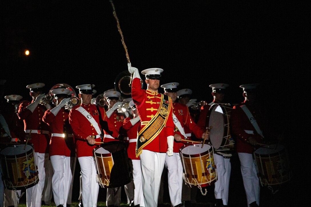 Gunnery Sgt. David Cox, assistant drum major, “The Commandant’s Own,” U.S. Marine Drum and Bugle Corps, marches during a Friday Evening Parade at Marine Barracks Washington, April 29, 2022.The guest of honor for the evening was Gen. David H. Berger, the 38th Commandant of the Marine Corps, and the hosting official was Col. Robert A. Sucher, the commanding officer of Marine Barracks Washington. (U.S. Marine Corps photo by Lance Cpl. Pranav Ramakrishna )