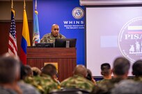 U.S. Army Soldier, Sgt. Maj. Ramell J. Boyd, Human Resources Command promotions and evaluations branch sergeant major, talks to students of the Programa Integral para Suboficiales de Alta Jerarquía 16 or PISAJ 16 class on Fort Benning, Ga., May 5, 2022. PISAJ is a military-to-military engagement conducted semi-annually with the Colombian army and other invited participants as a part of a biannual agreed-to-action between the U.S. and Colombia focused on NCOs and designed to increase the capacity and regional collaboration between both militaries. (U.S. Army photo by Spc. Joshua Taeckens)